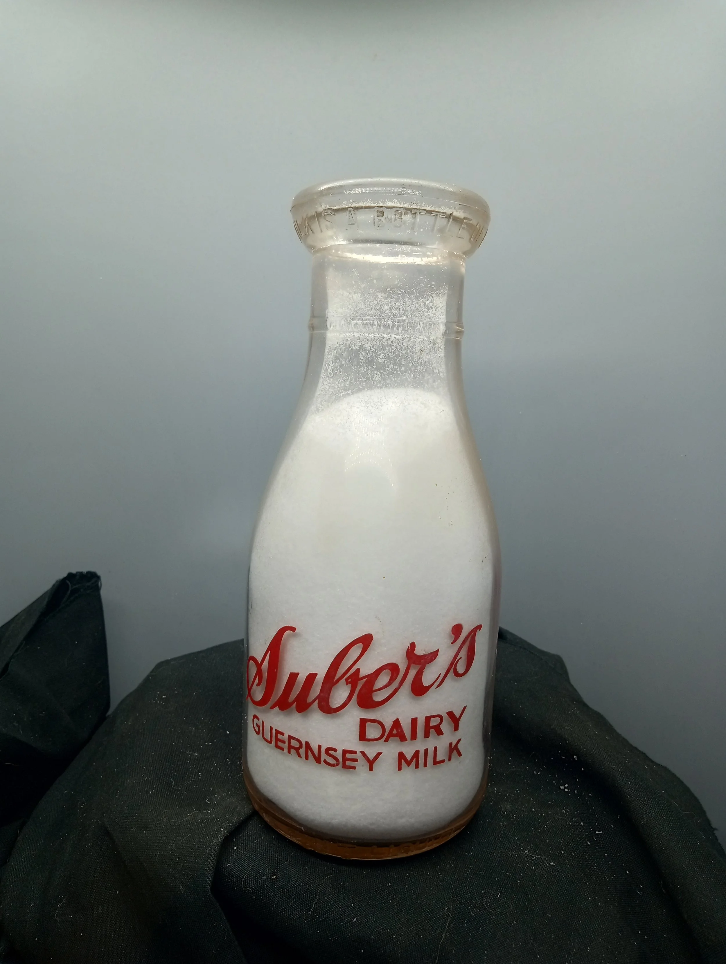 TOP - A BOTTLE OF MILK IS A BOTTLE OF HEALTH - FRONT - SUBER'S / DAIRY / GUERNSEY MILK / ONE PINT LIQUID BACK - GUERNSEY / MILK / REGISTERED
