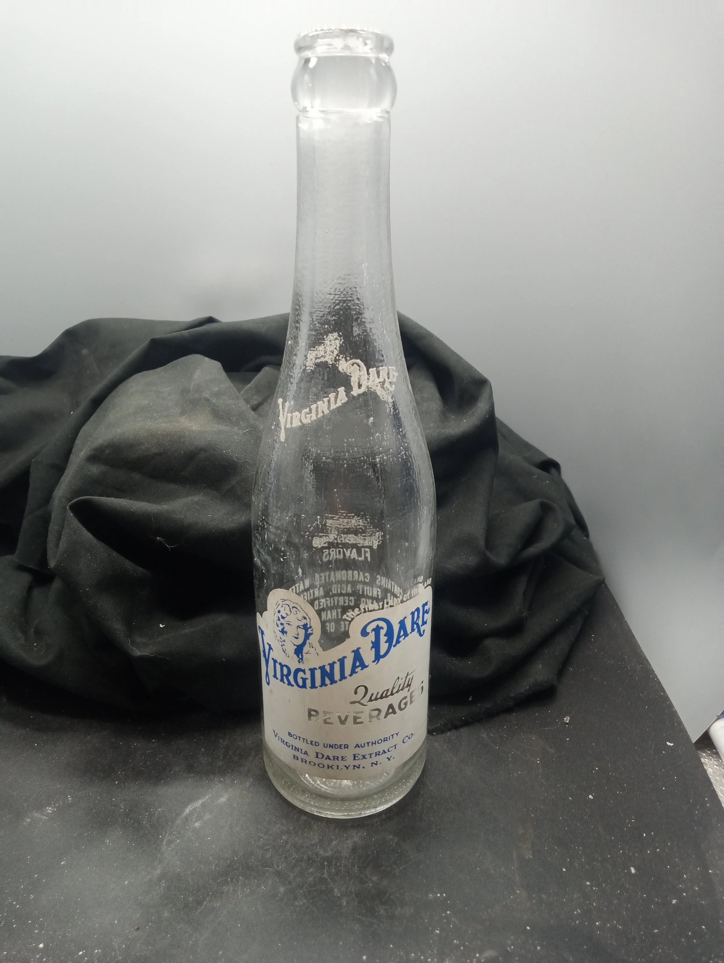 AGE - 1958 - TYPE - MACHINE - FRONT - (shoulder) VIRGINIA DARE (body) THE FIRST LADY OF THE LAND / VIRGINIA DARE / QUALITY / BEVERAGES / BOTTLED UNDER AUTHORITY / VIRGINIA DARE EXTRACT CO. / BROOKLYN, N.Y. - BACK - ... CHARLESTON, S. C. - COLOR - CLE