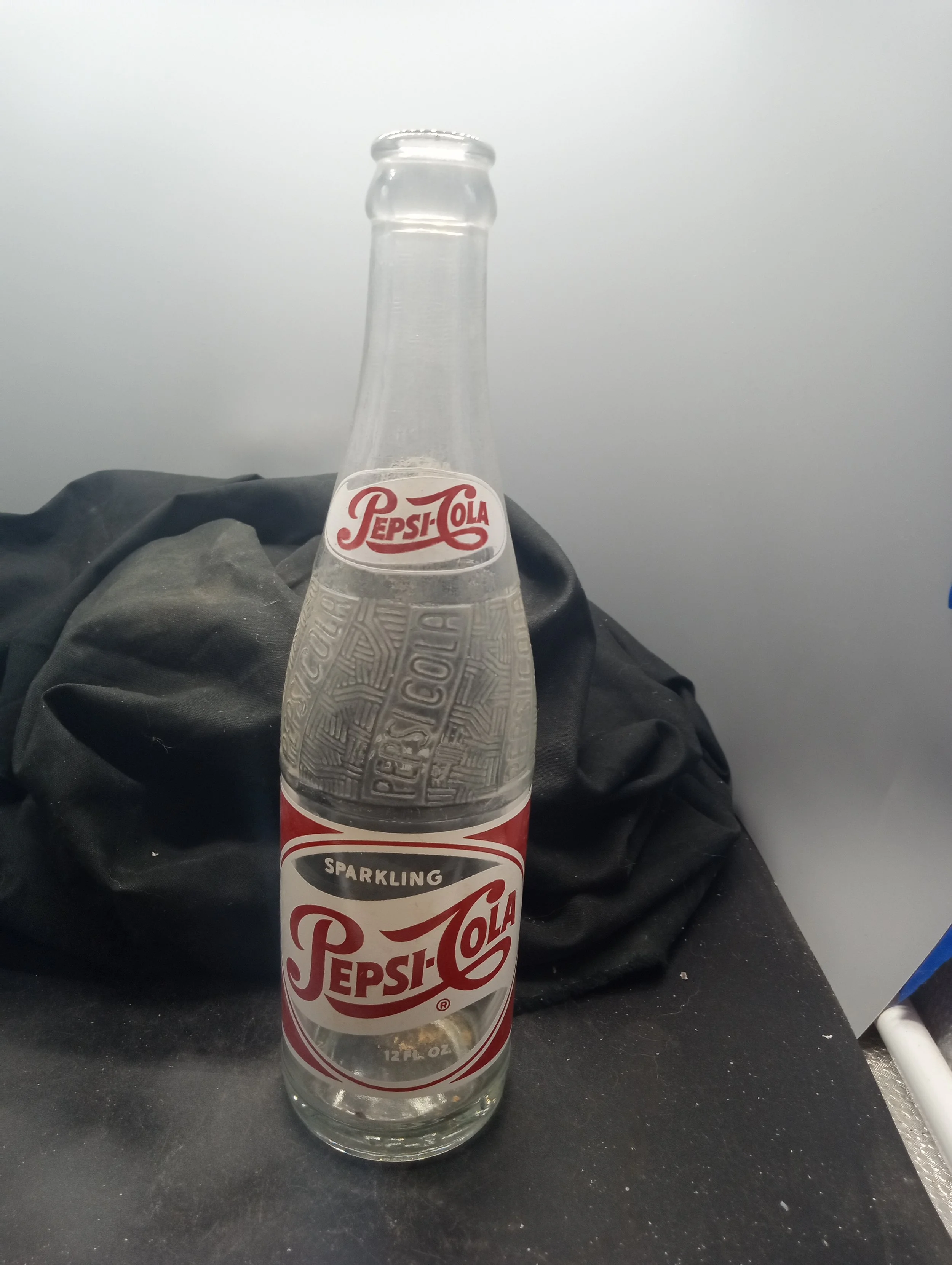 AGE - 1957 - TYPE - MACHINE - FRONT (PEPSI-COLA) (body) SPARKLING / PEPSI-COLA (R) / 12 FL. OZ. - BACK - (shoulder) PEPSI / 735 (body) FRANCHISED BOTTLER: / PEPSI-COLA BOTTLING CO. / ROCK HILL, S.C. - BOTTOM - L.G.W.  20  A 57  15 - COLOR - CLEAR \ R