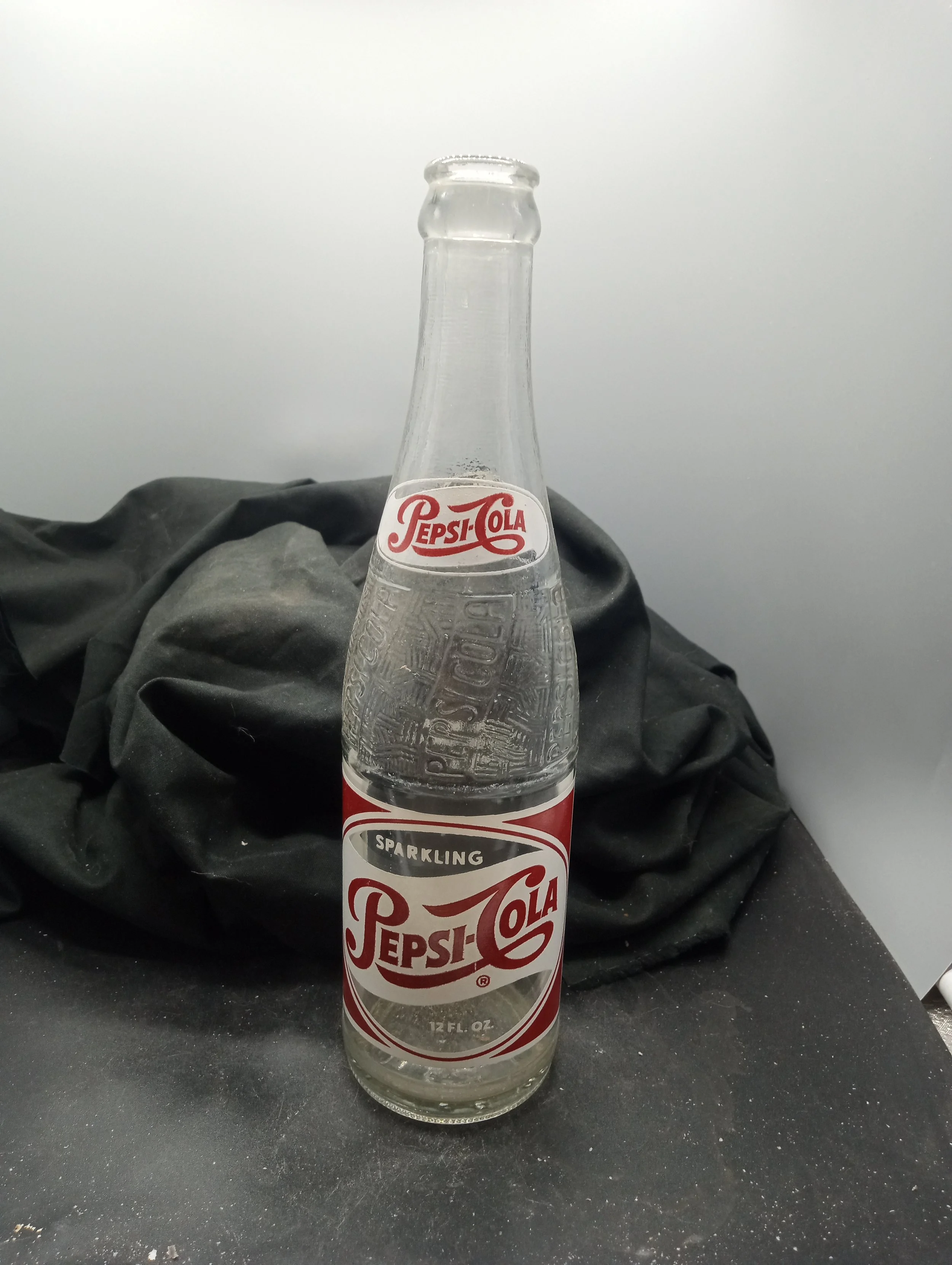 AGE - 1957 - TYPE - MACHINE - FRONT - (shoulder narrow oval) PEPS-COLA (body) SPARKLING / PEPSI-COLA (R) / 12 FL. OZ. - BACK - (shoulder) PEPSI / 735 (body) FRANCHISED BOTTLER: / PEPSI-COLA BOTTLING CO. / COLUMBIA, S.C. - BOTTOM - L G W 36 B 57 5 - C