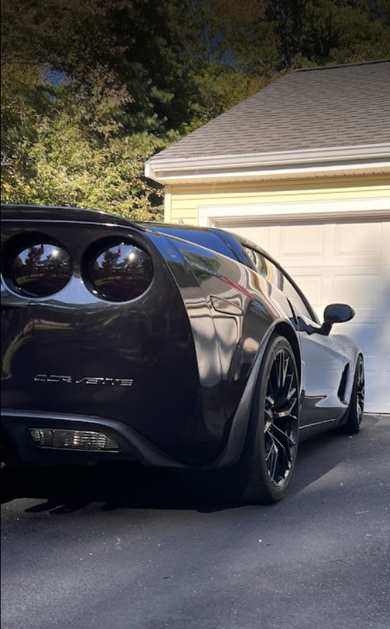 Black Corvette after professional mobile car detailing service by Dusty Details RI.