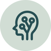 Outline of a human head with circuit lines inside connecting to dots, representing artificial intelligence or technology.
