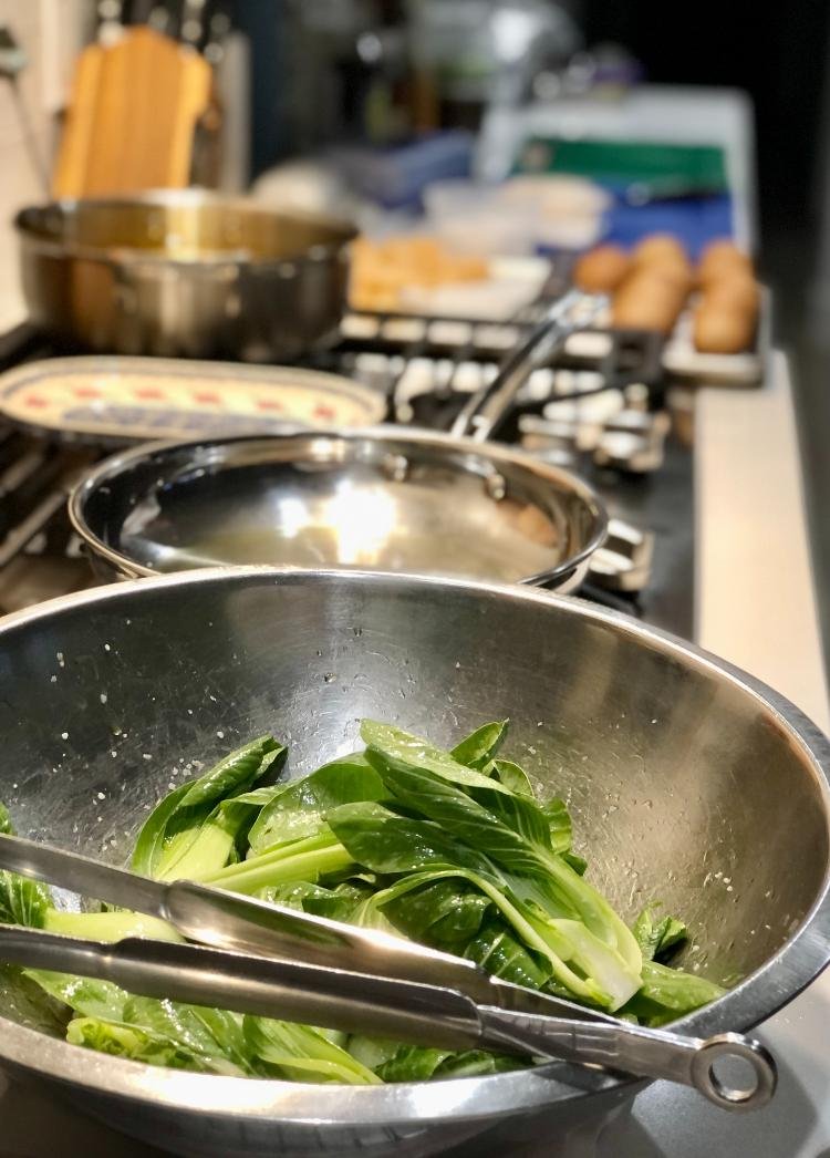 Fresh vegetables being cooked during on-site meal preparation