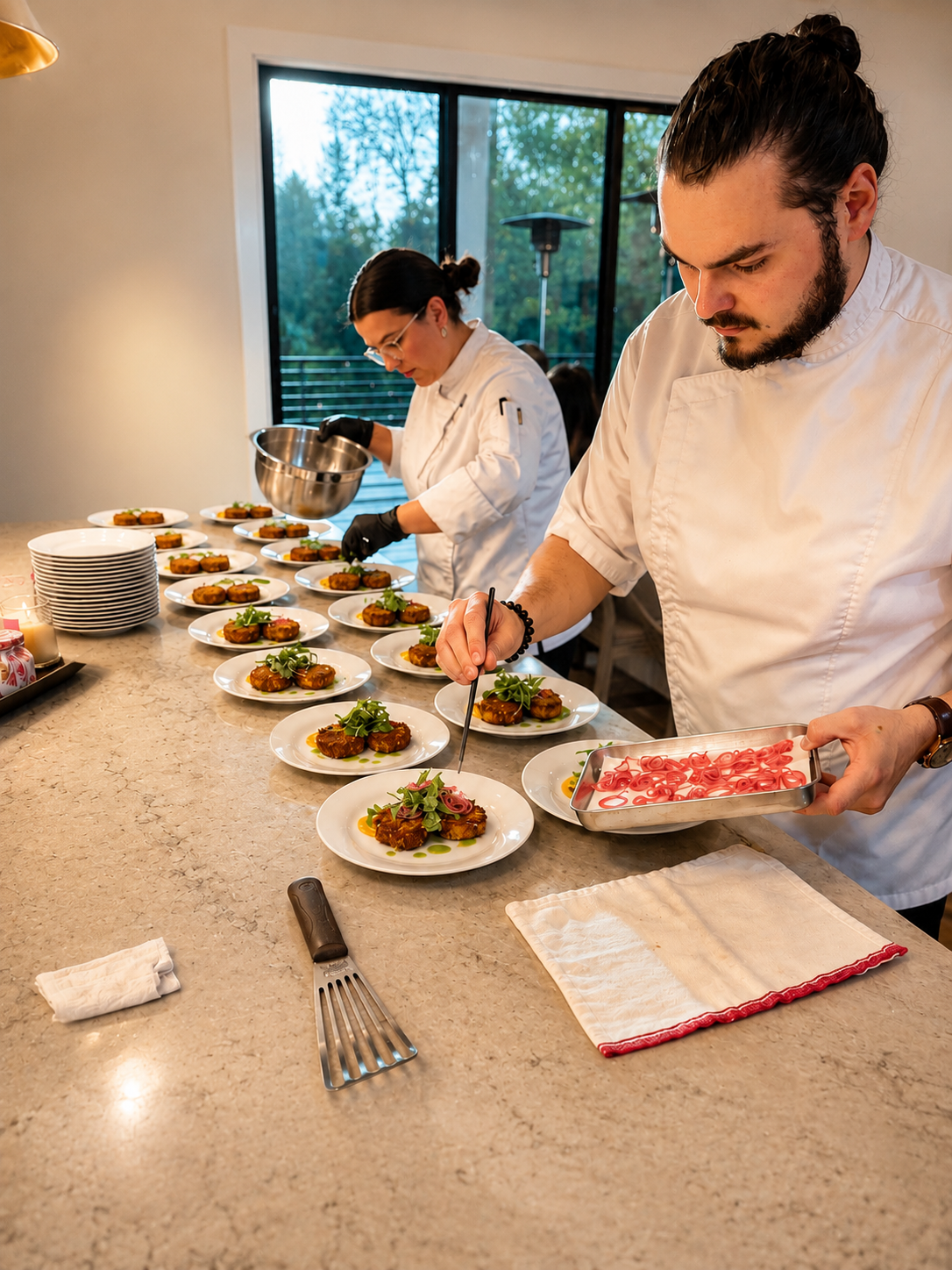 Gourmet All Day chefs plating individual courses in a client's home