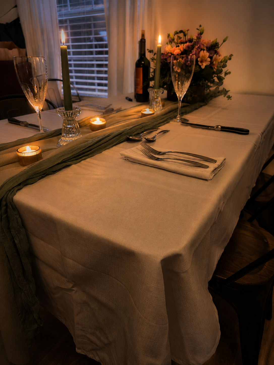 Candlelit table set for an intimate private dinner
