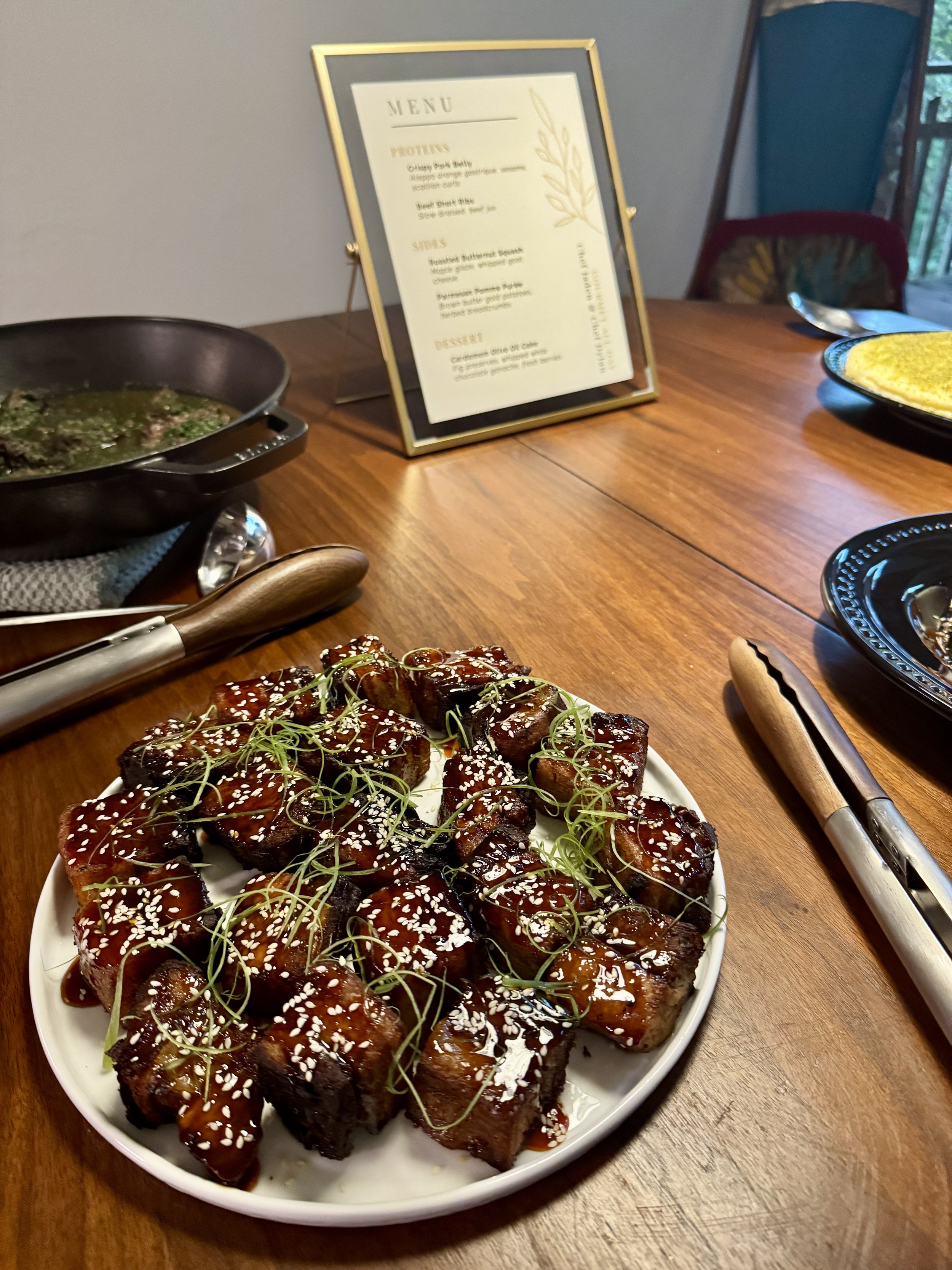 Family-style dishes arranged at the table for guests to share
