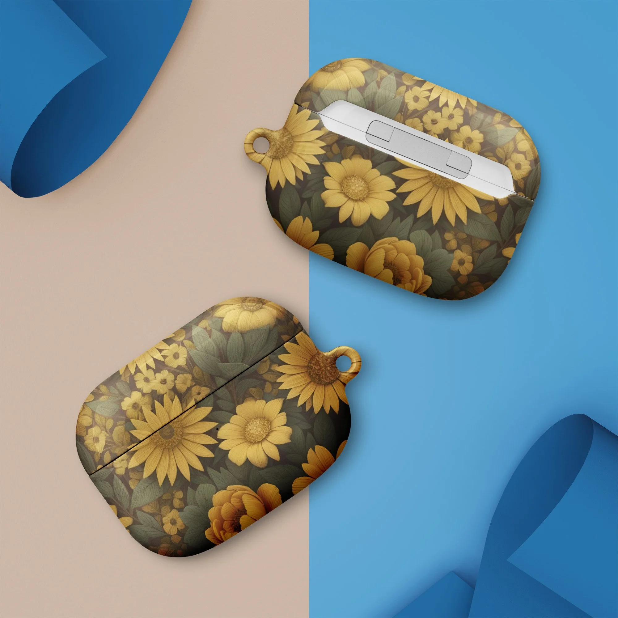 A disposable face mask with a sunflower pattern lying on a surface with a beige and blue background.