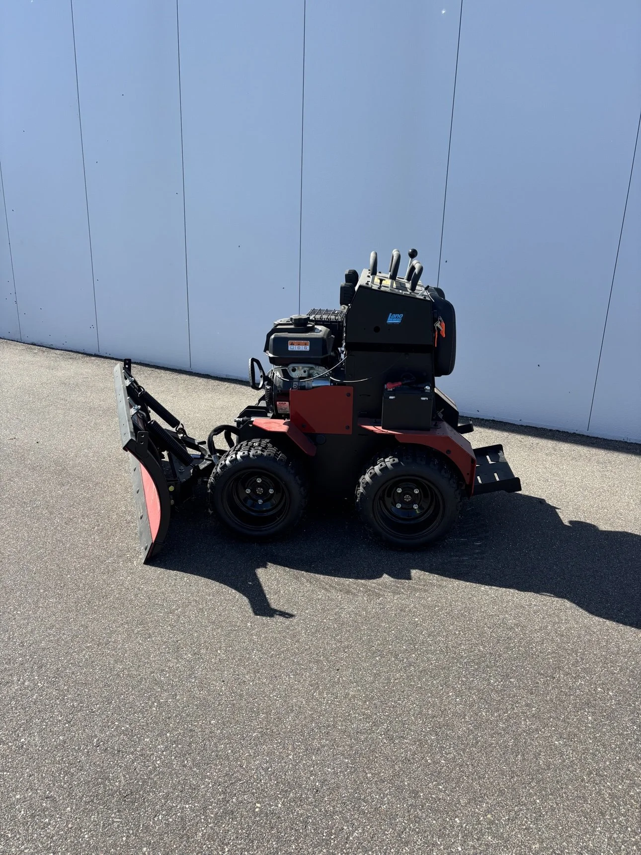BOSS SR Scout stand-on snow removal machine with plow blade