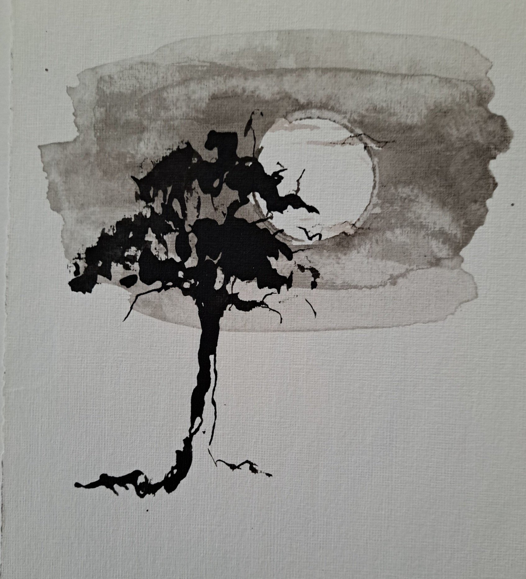 The tree stood silent under the moon