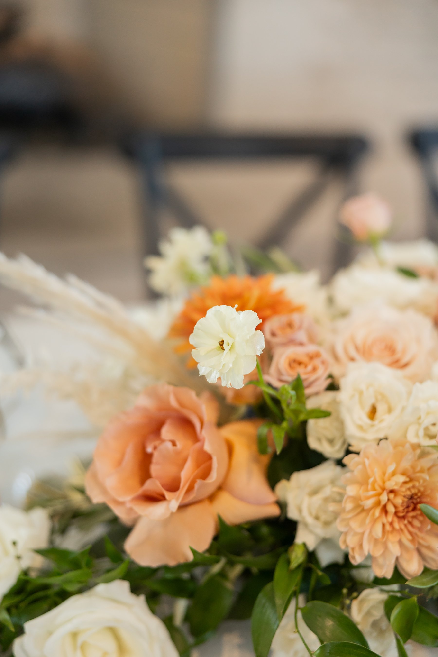 A Louisville Wedding Photographer, Emily Peters photographing wedding details at the Indiana wedding venue Iron and Ember