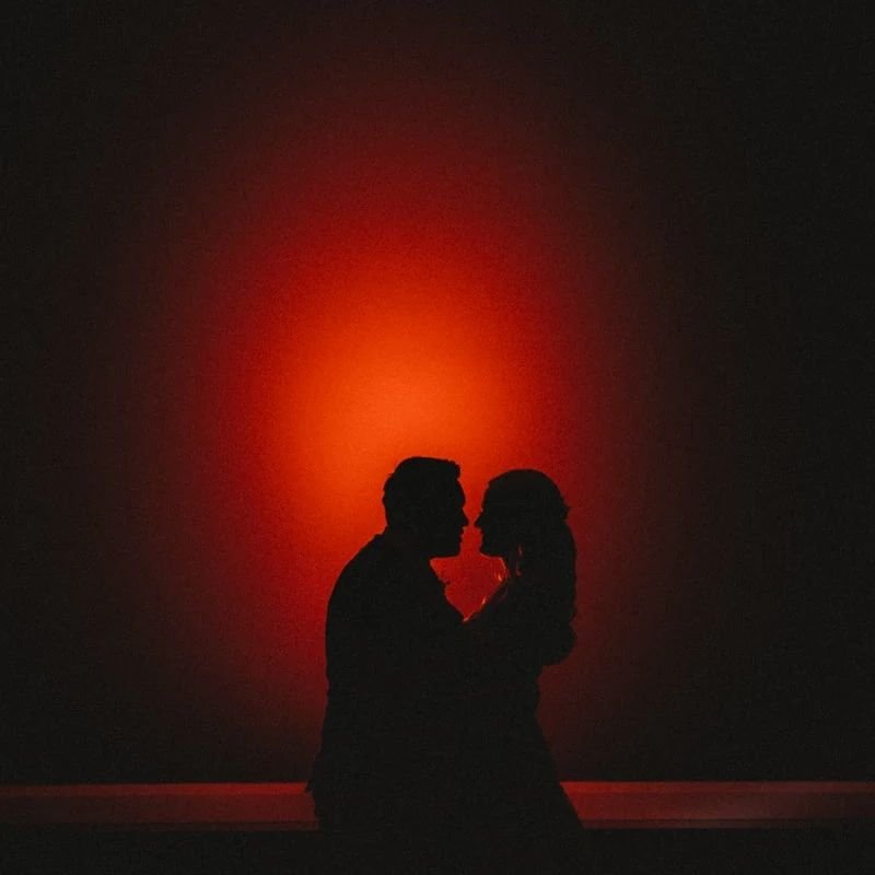 Throwback to this magical moment captured in silhouette with a splash of red. 💑✨ Can't believe this picture got deleted &ndash; maybe my kids had a hand in it? 😅 Either way, it's back where it belongs because it never fails to bring a smile to my f