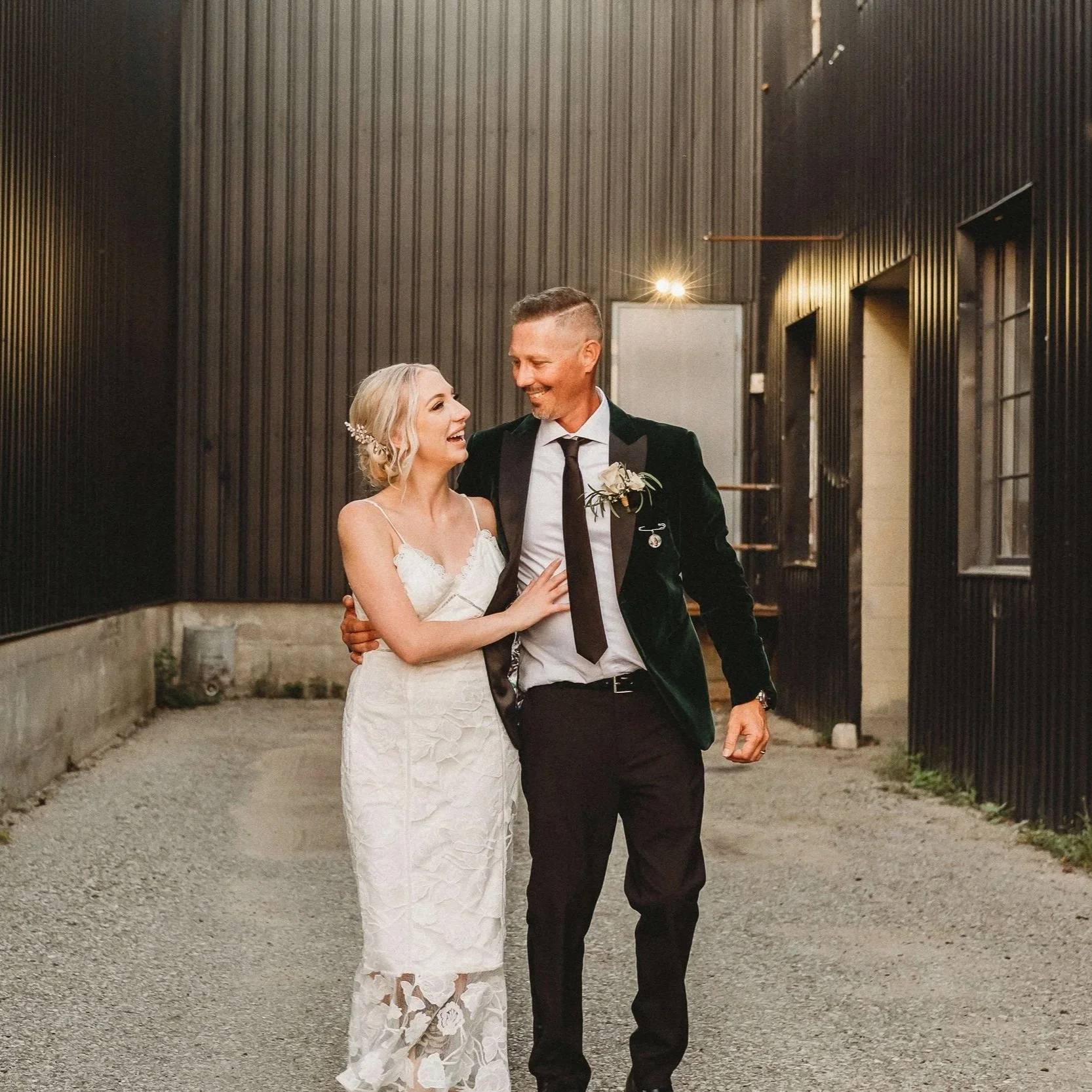 wedding couple, couple walking happily outside the four fathers in Cambridge Ontario