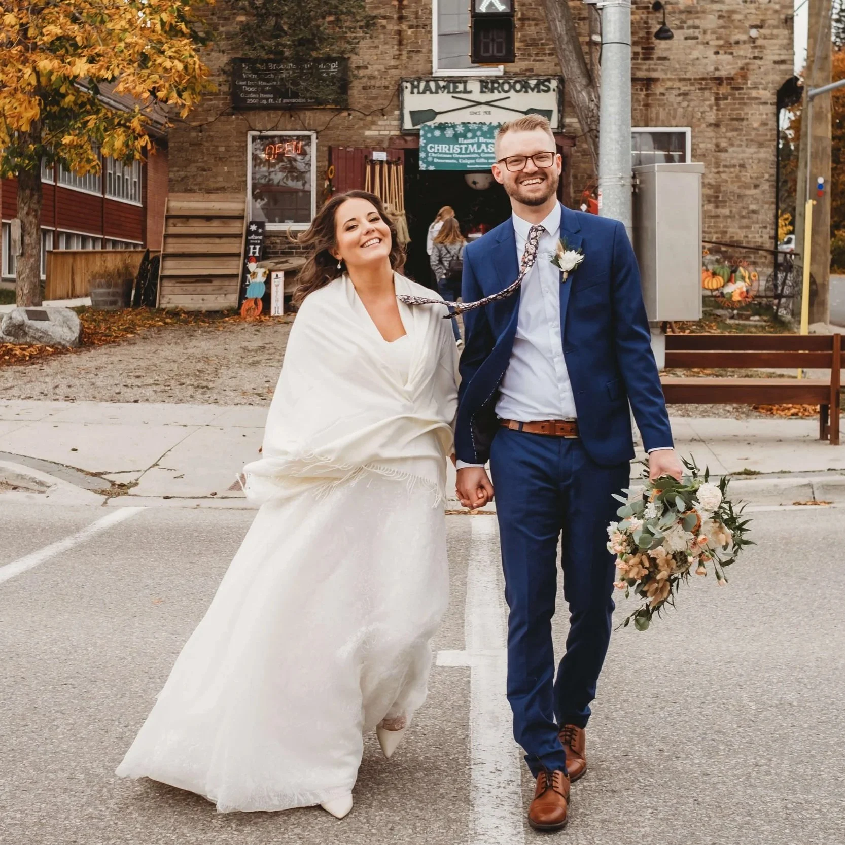 wedding couple walking on the street in st jacobs, ontario
