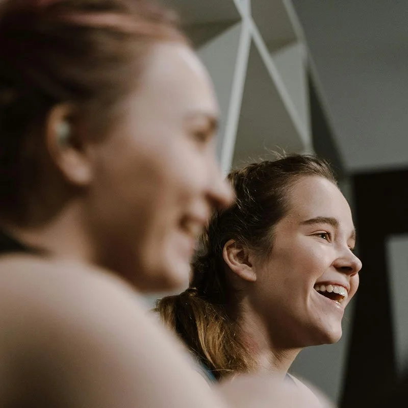two women laughing together