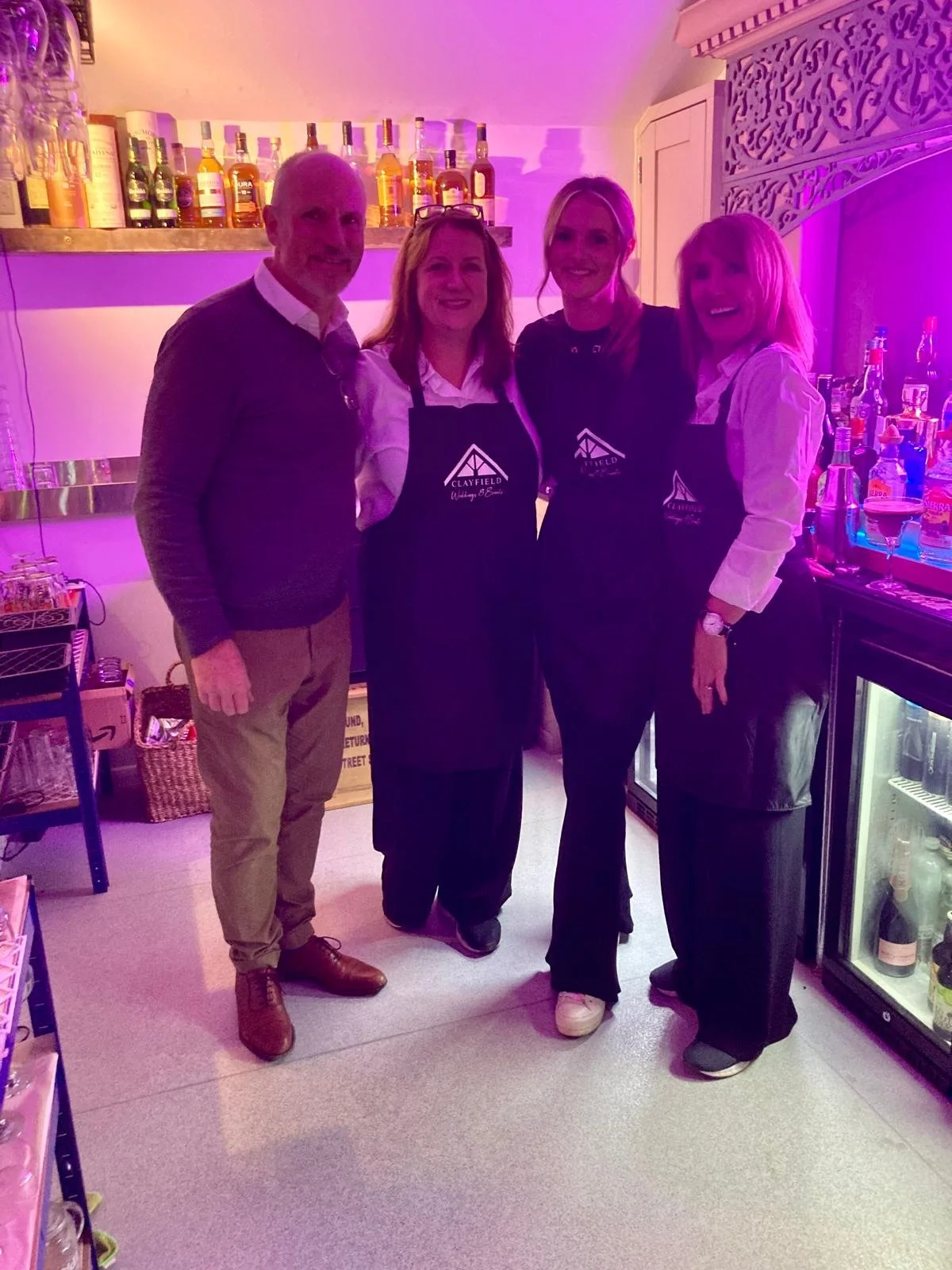 Wayne with his daughter and sisters behind the bar at Clayfield Farm