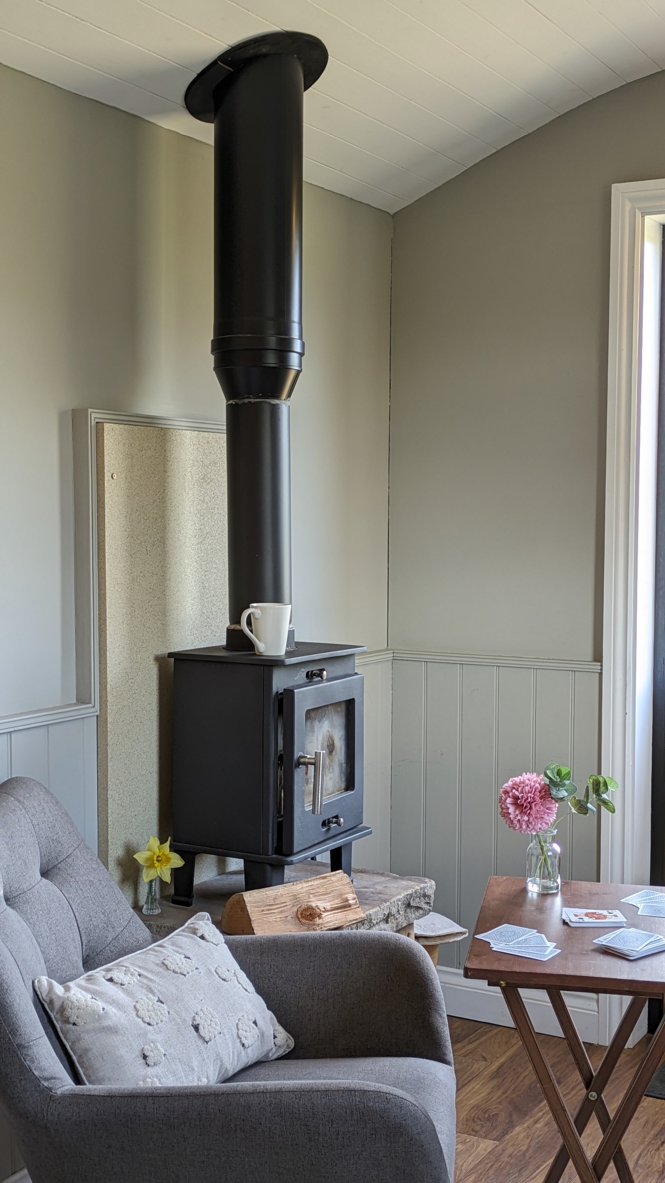Clayfield Farm shepherd's hut log burner and card games