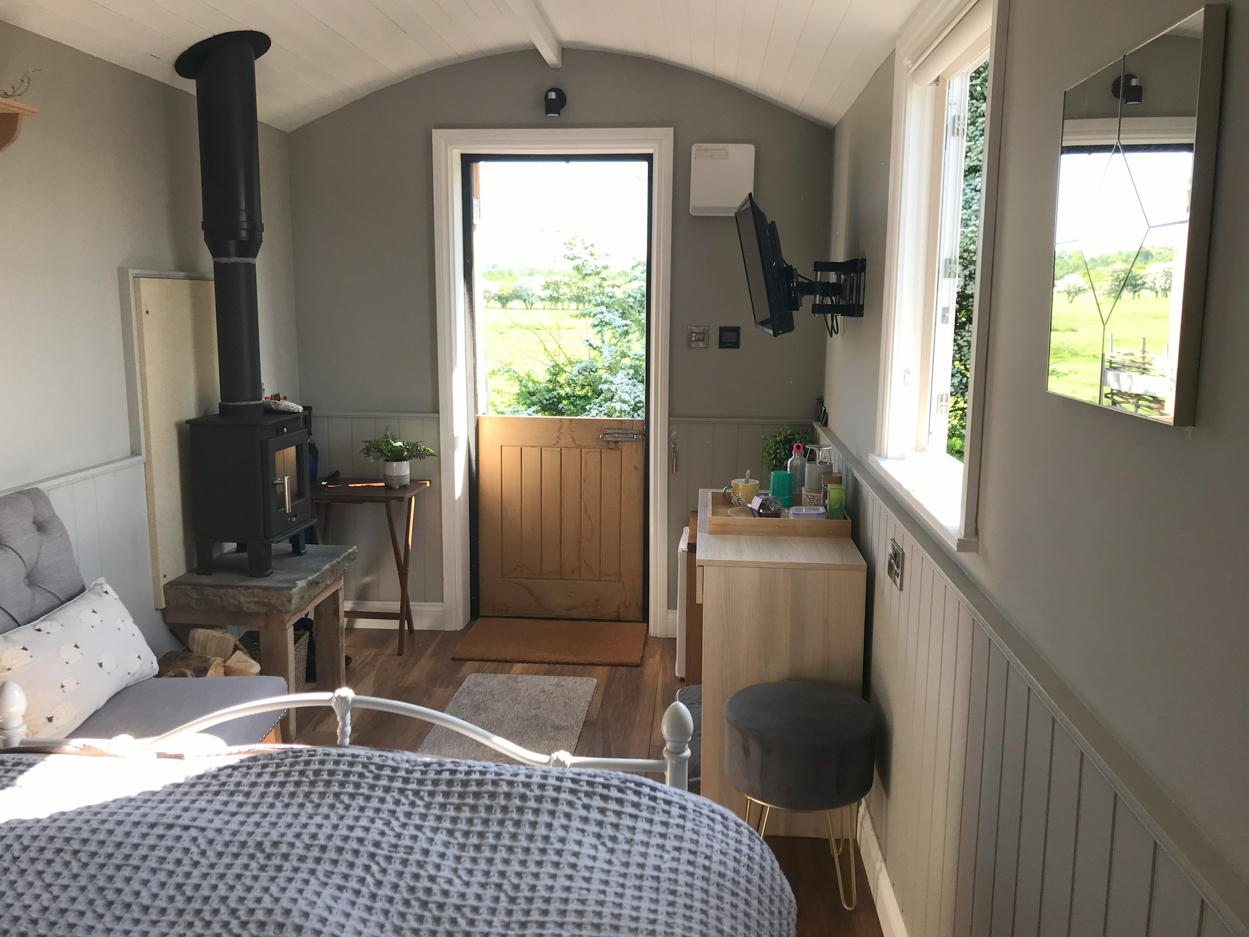 Clayfield Farm shepherd's hut stable door, log burner, countryside view