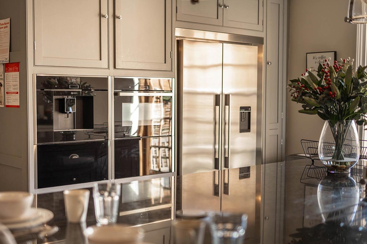 Clayfield Farmhouse modern fitted kitchen with built in ovens and fridge