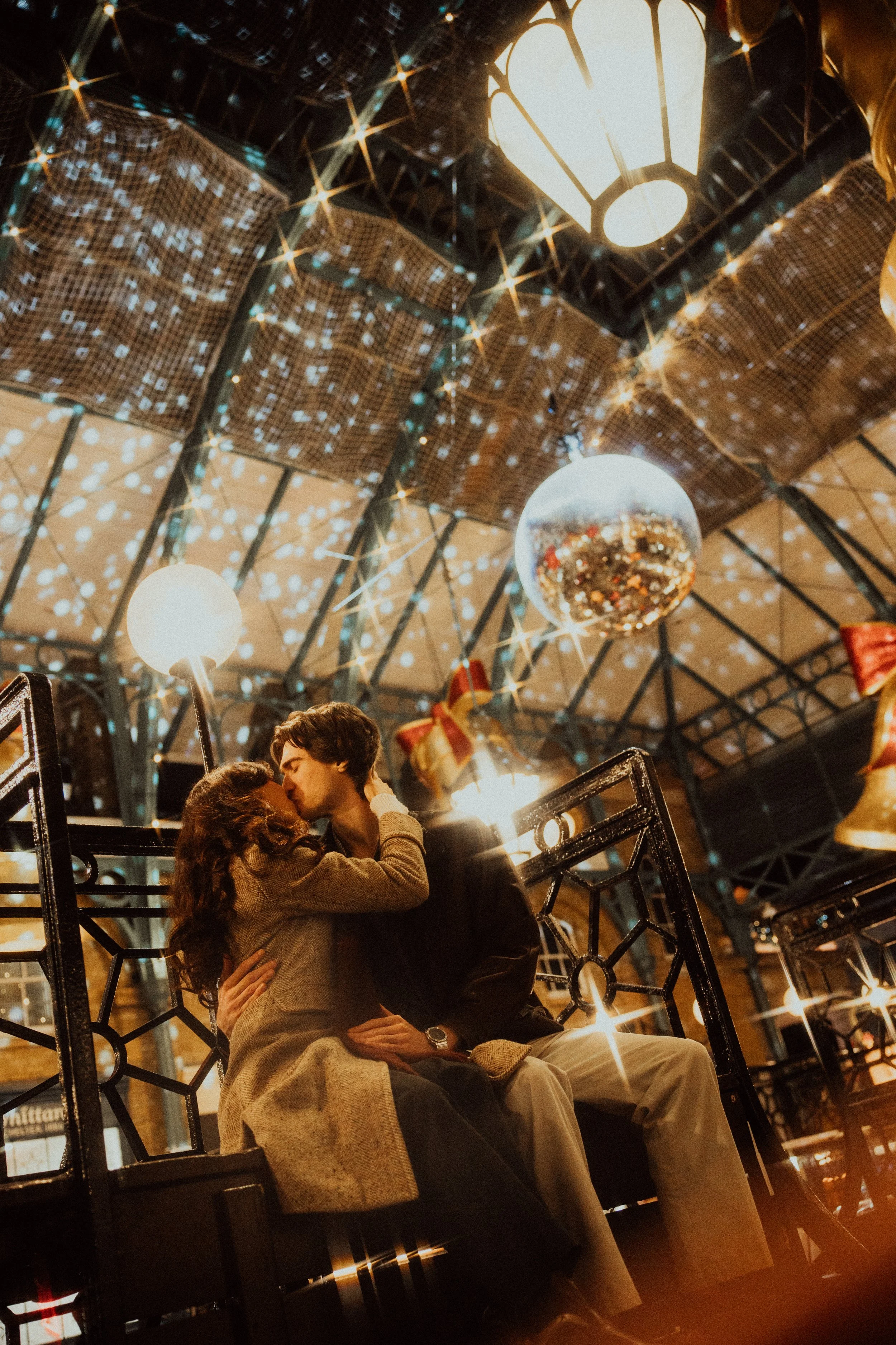  couple kissing under the London lights 