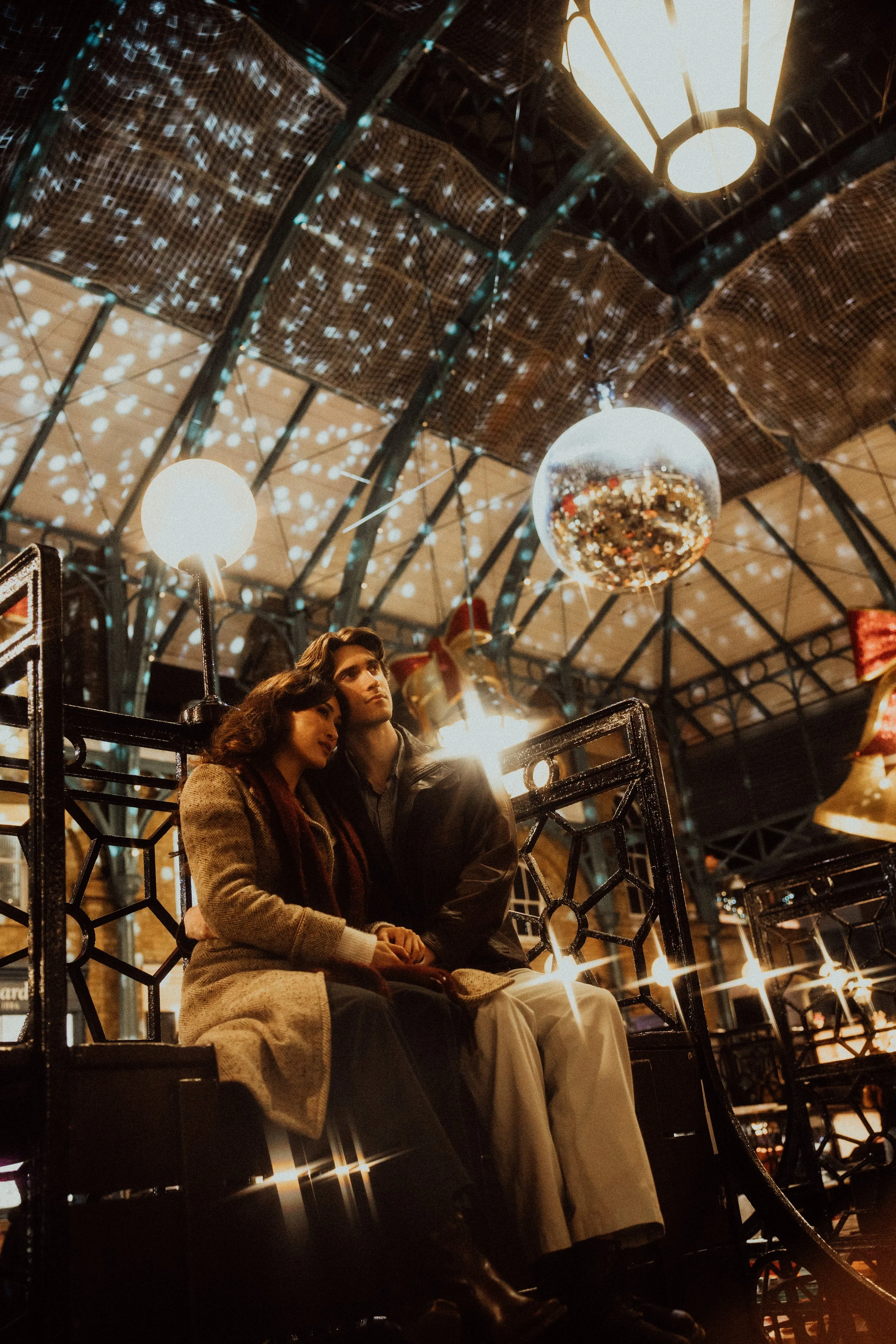  sitting inside Apple market in London during christmas time 