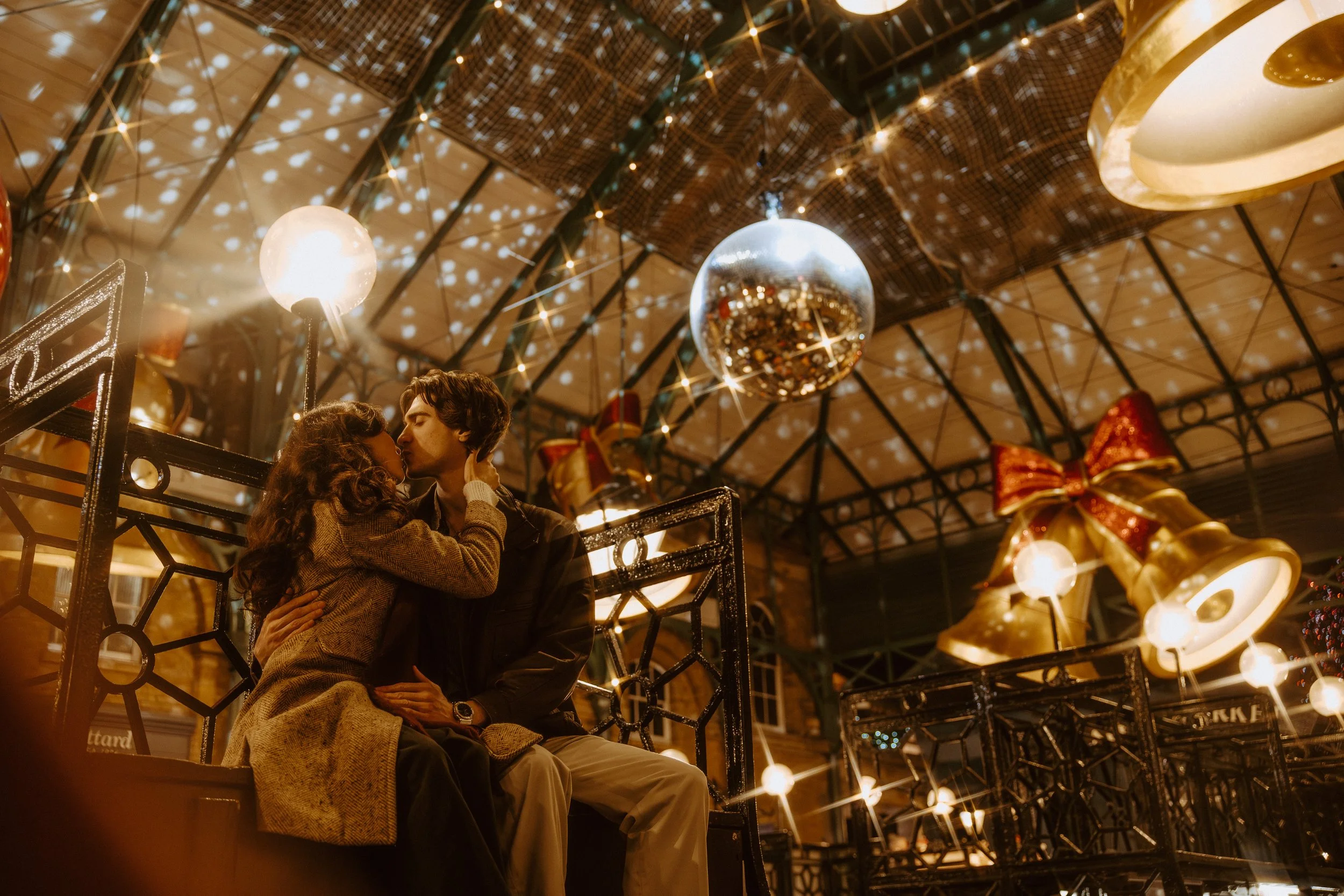 couple kissing in Covent Garden in London during Christmas