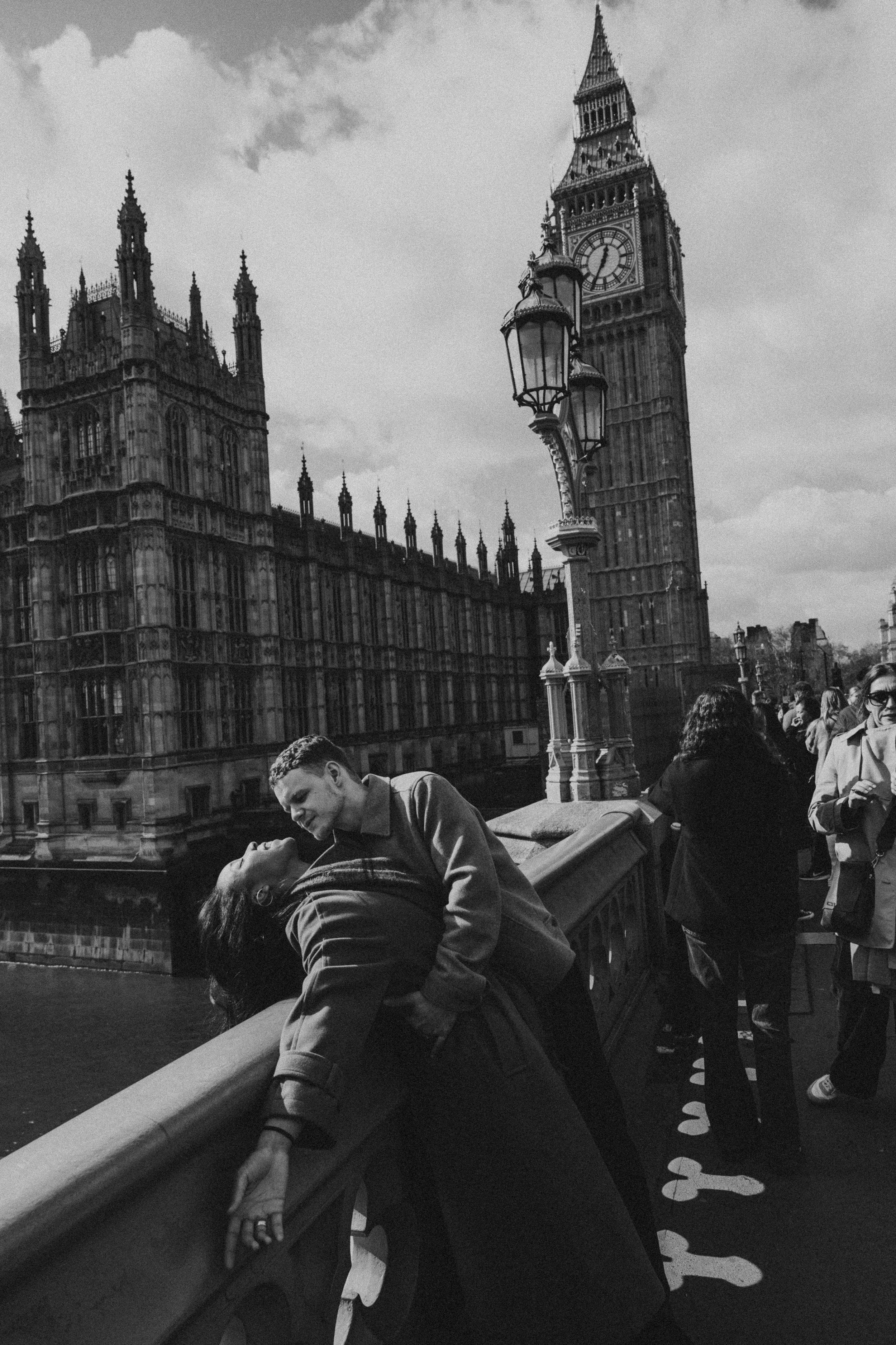 Caleb dipping Amira on the bridge before Big Ben