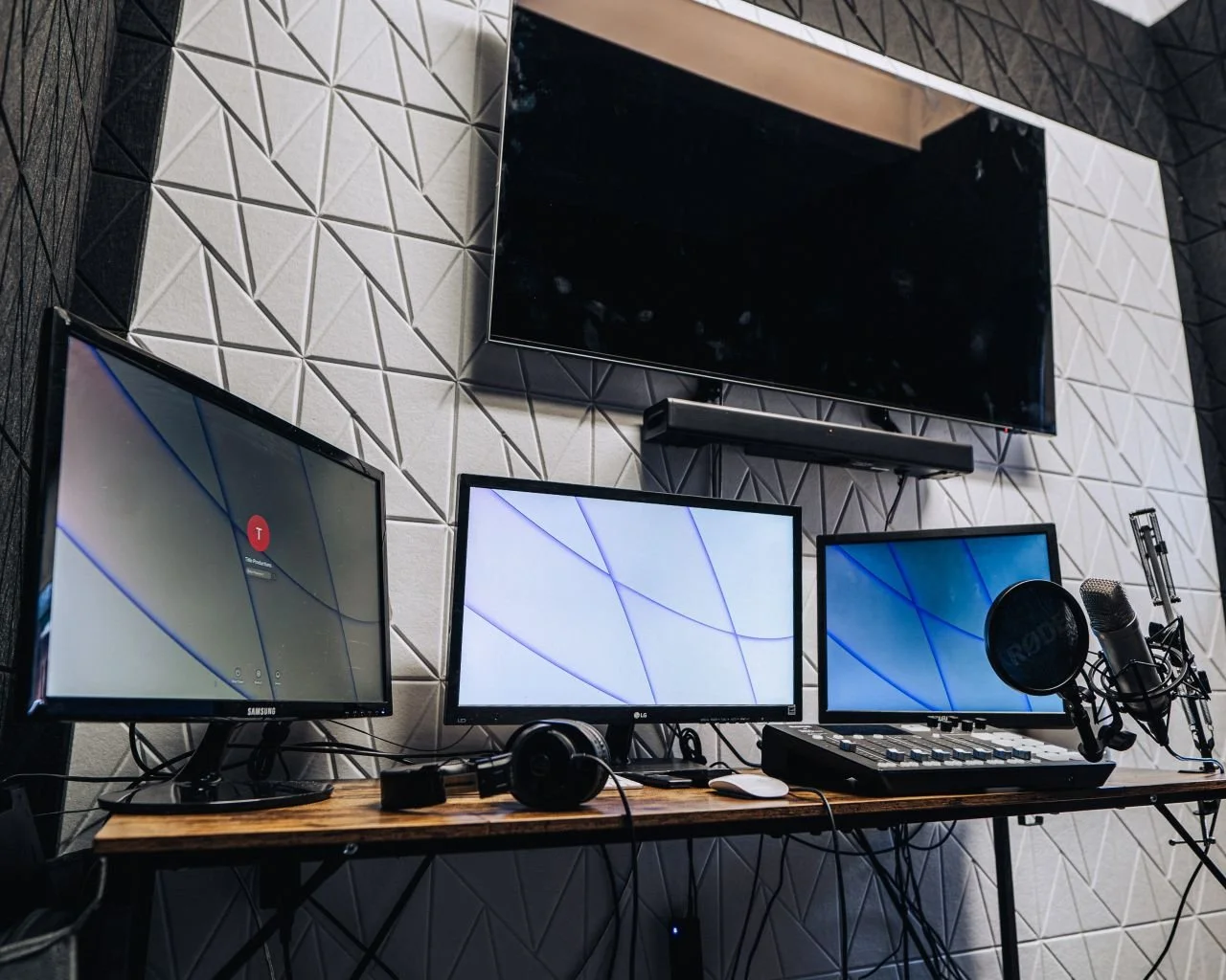 Professional studio setup with computers, editing gadgets, and video production tools.