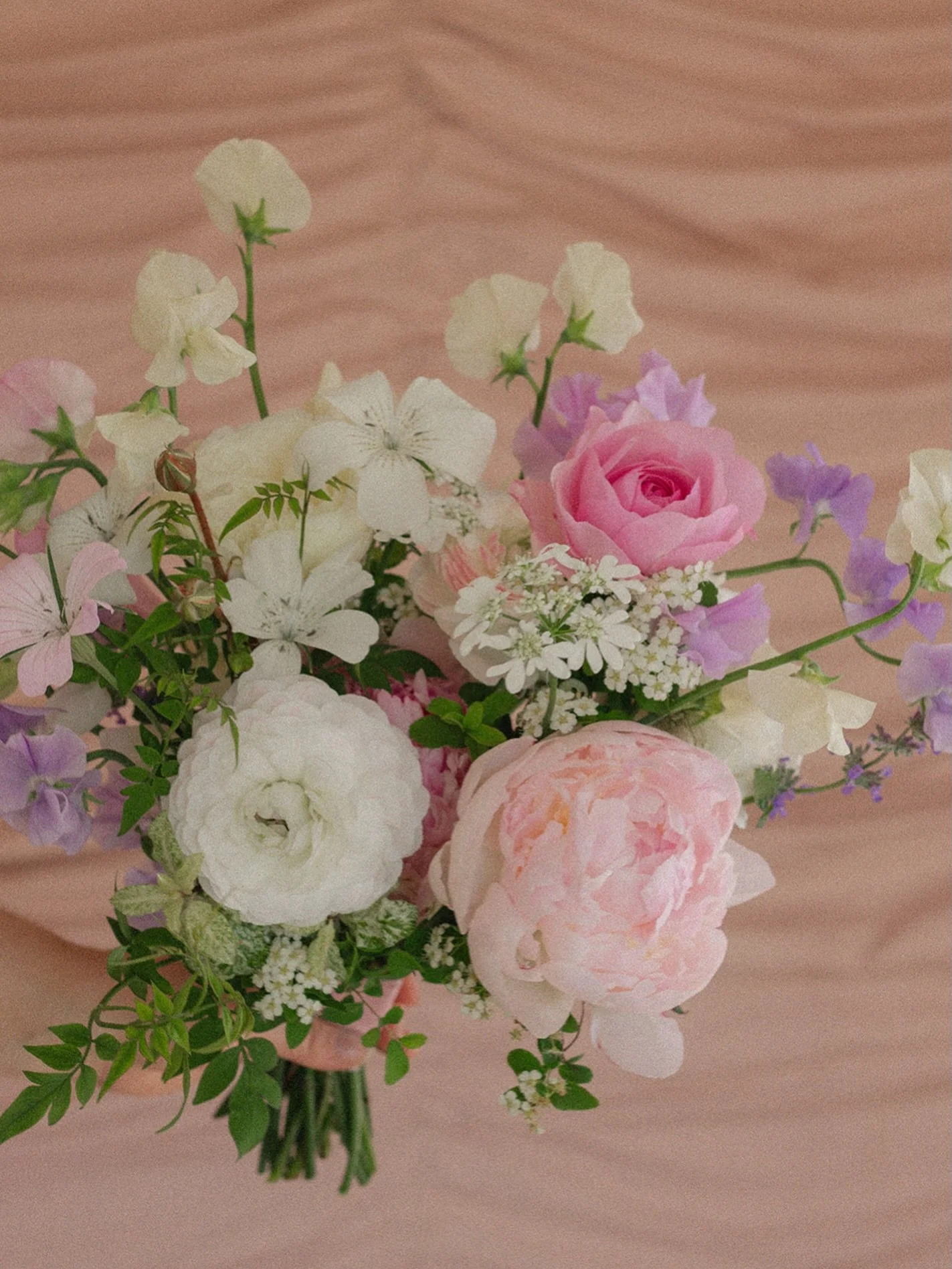 For Nicola 🌸✨

Featuring the loveliest May flowers, including blousy peonies, ranunculus, delicately scented sweet peas, garden roses, corncockle, orlaya, spirea and jasmine, to name just a few!

Created in our signature style; abundant, effortless,