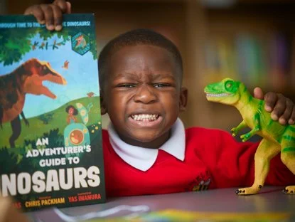 Pupil studying dinosaurs