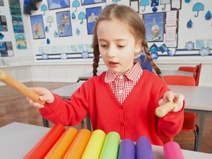 Pupil playing an instrument