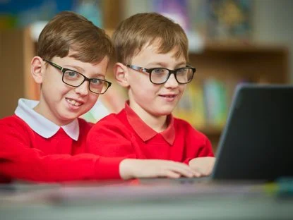 Pupils working on a laptop