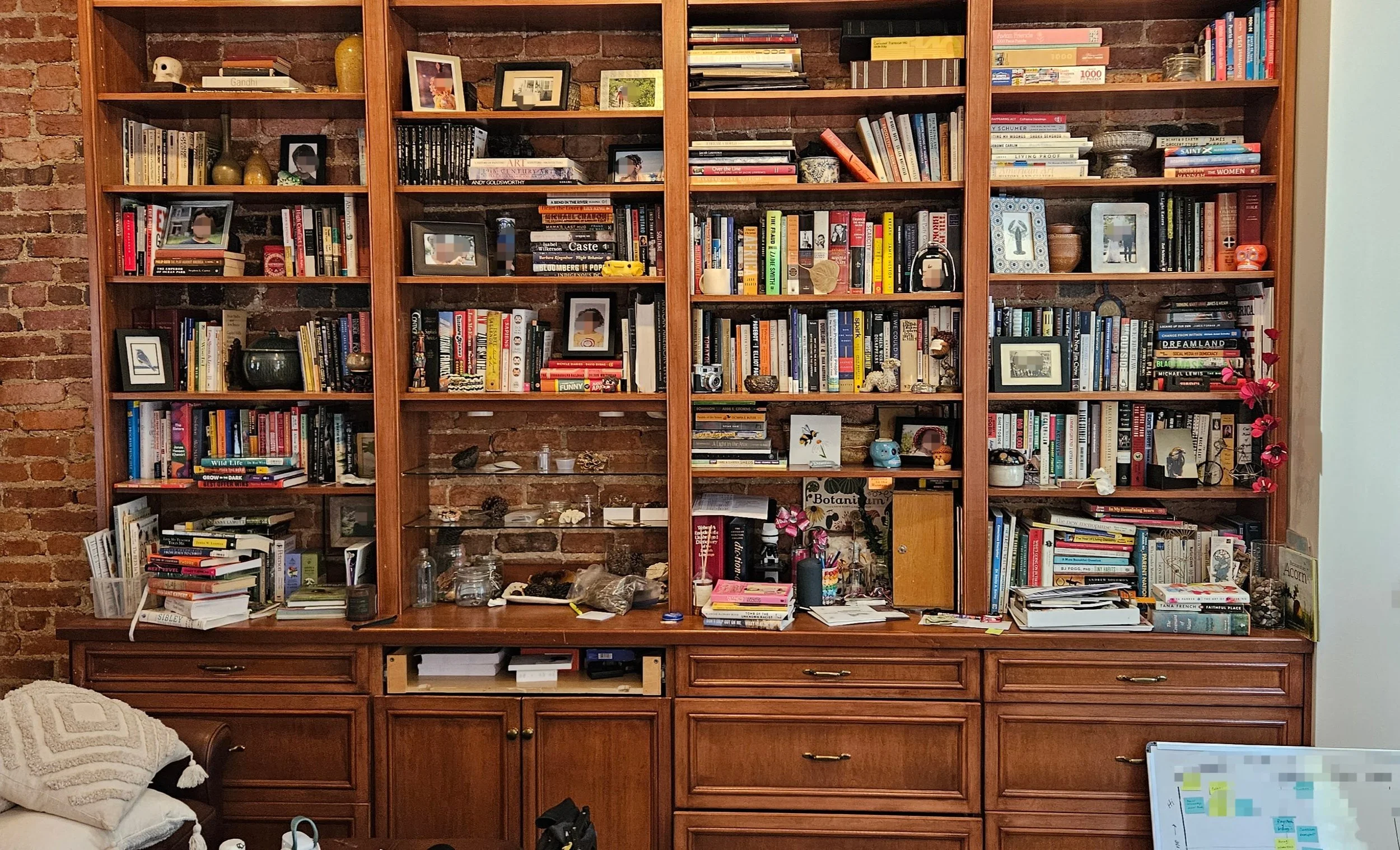 Messy bookcase shelves.