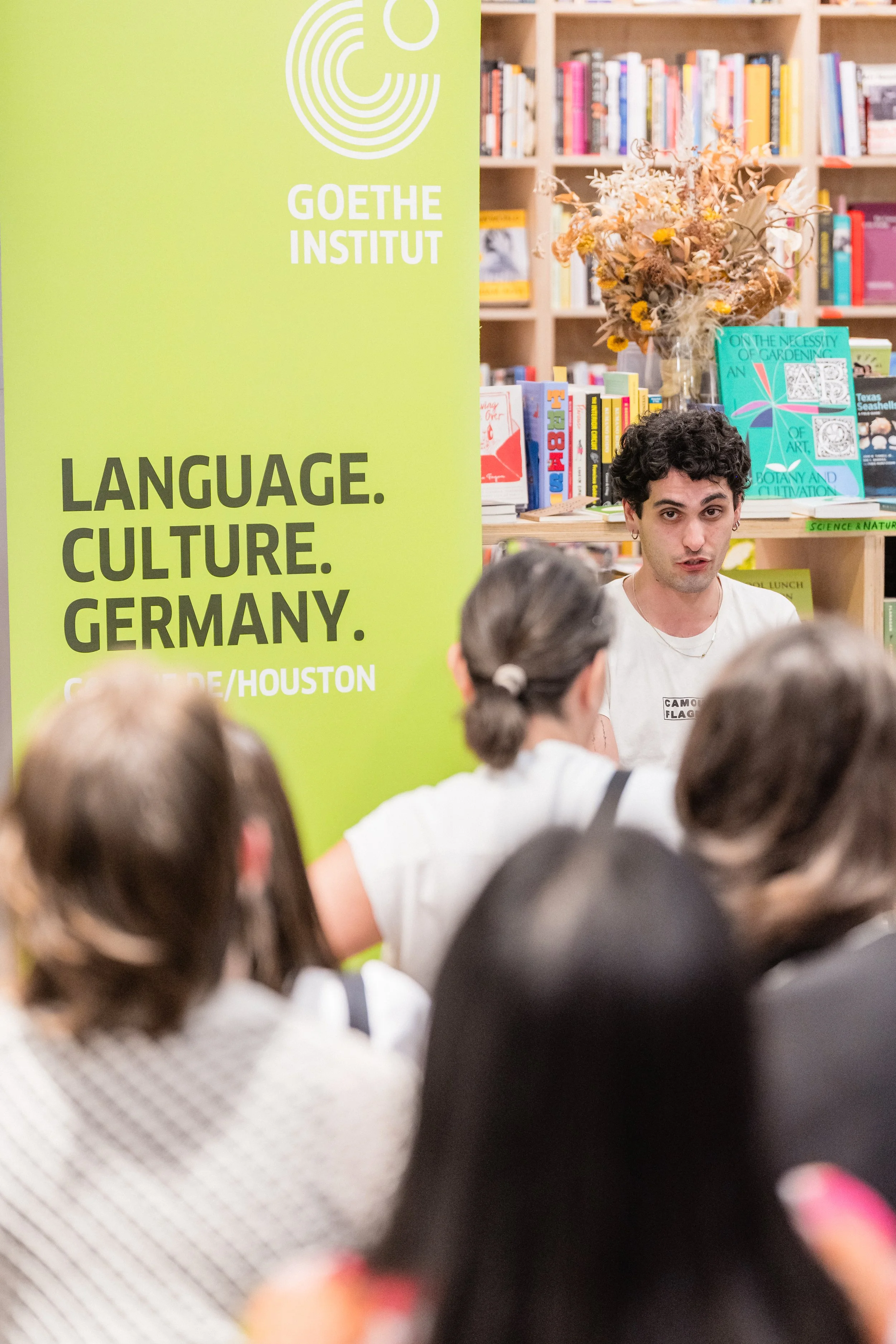 German writers Louise Kenn and Mücahit Türk during a reading at Basket Books & Art, Houston.