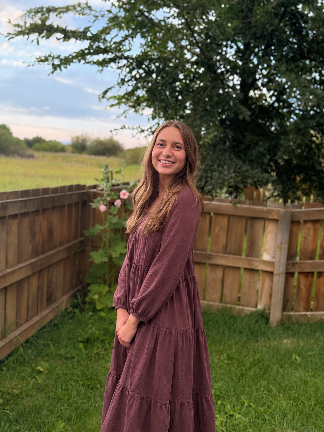 Picture of Hailie standing by tree