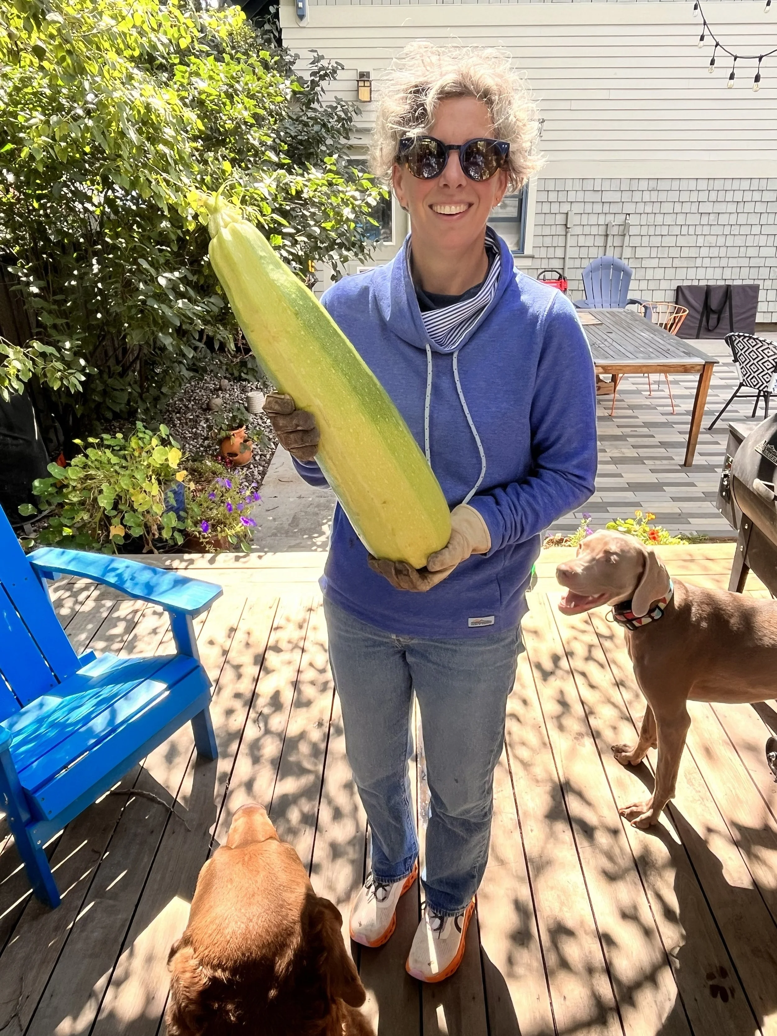 picture of Jamie outside holding a zucinni
