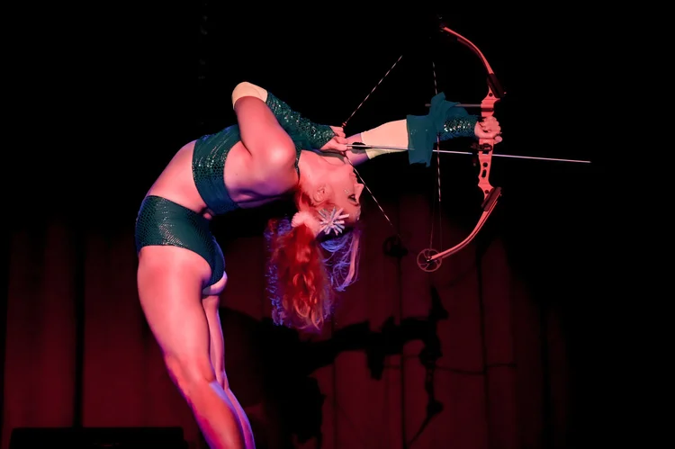 Talia Hazard in a deep backbend, drawing a bow with her feet