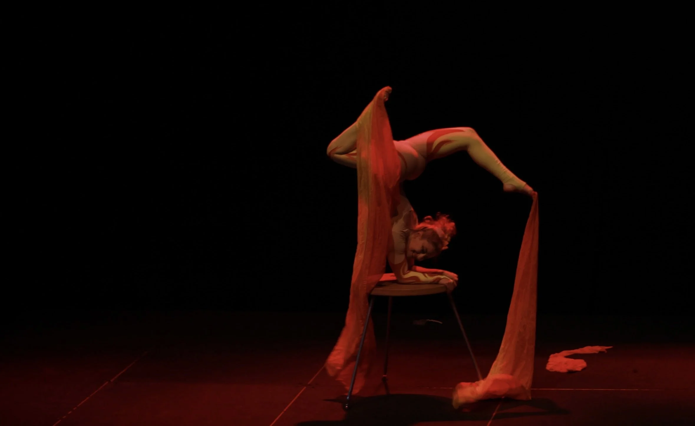 Talia Hazard in a deep inverted backbend on a contortion stand