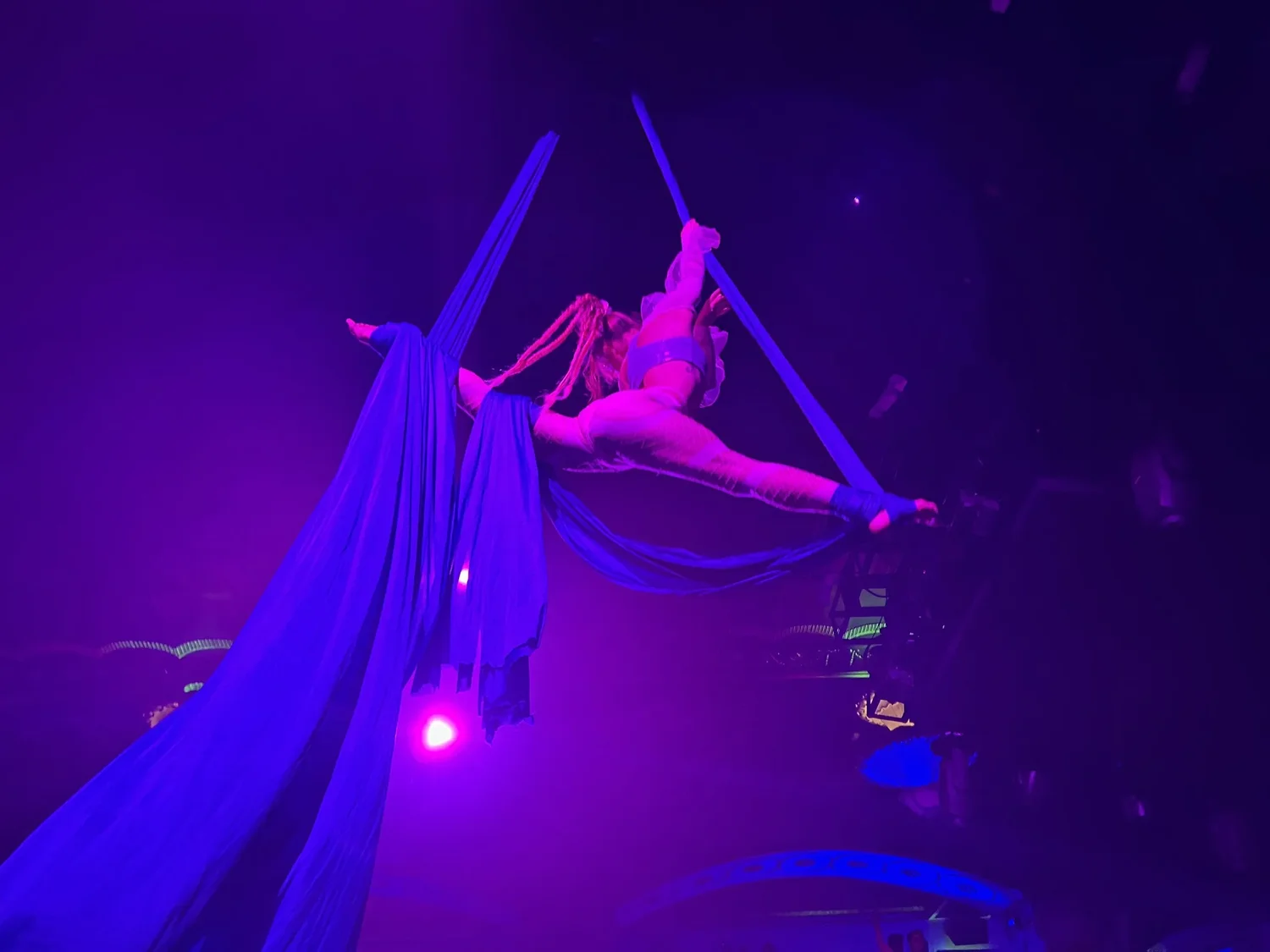 Talia Hazard suspended in purple aerial silks