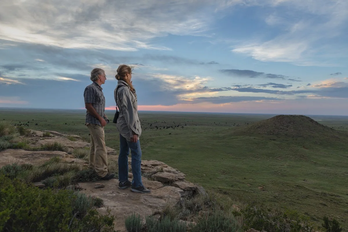 Project managers overlooking expansive protected grasslands in Colorado