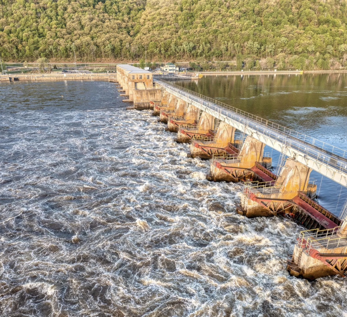 Water running through run-of-river hydroelectric dam Escuela de Minas in Colombia