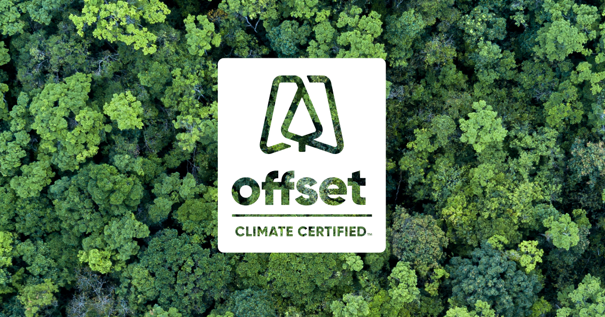 Offset Climate Certified badge over tropical forest of trees