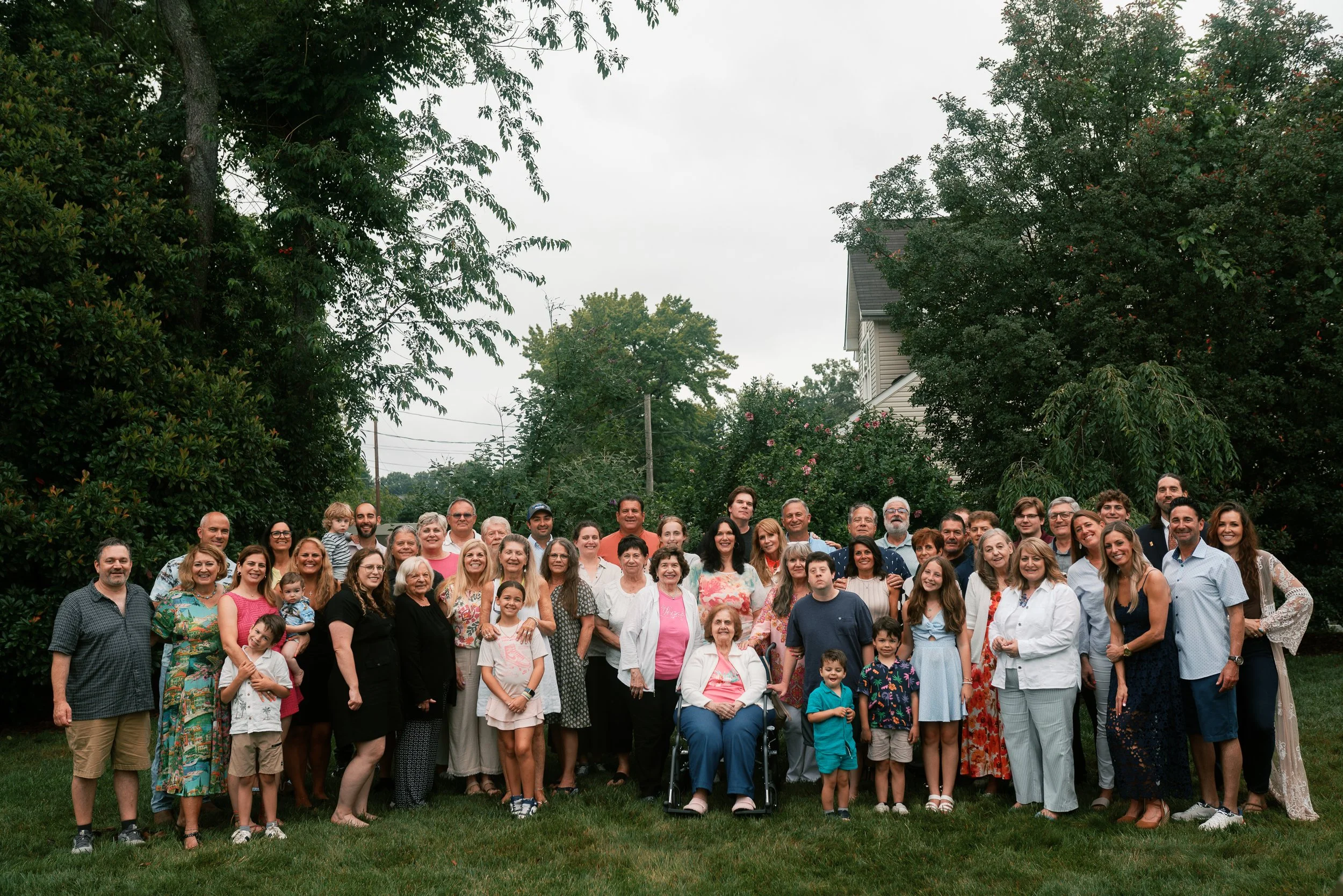 Large extended family group portrait outdoors at a multigenerational reunion in Haddonfield, New Jersey.