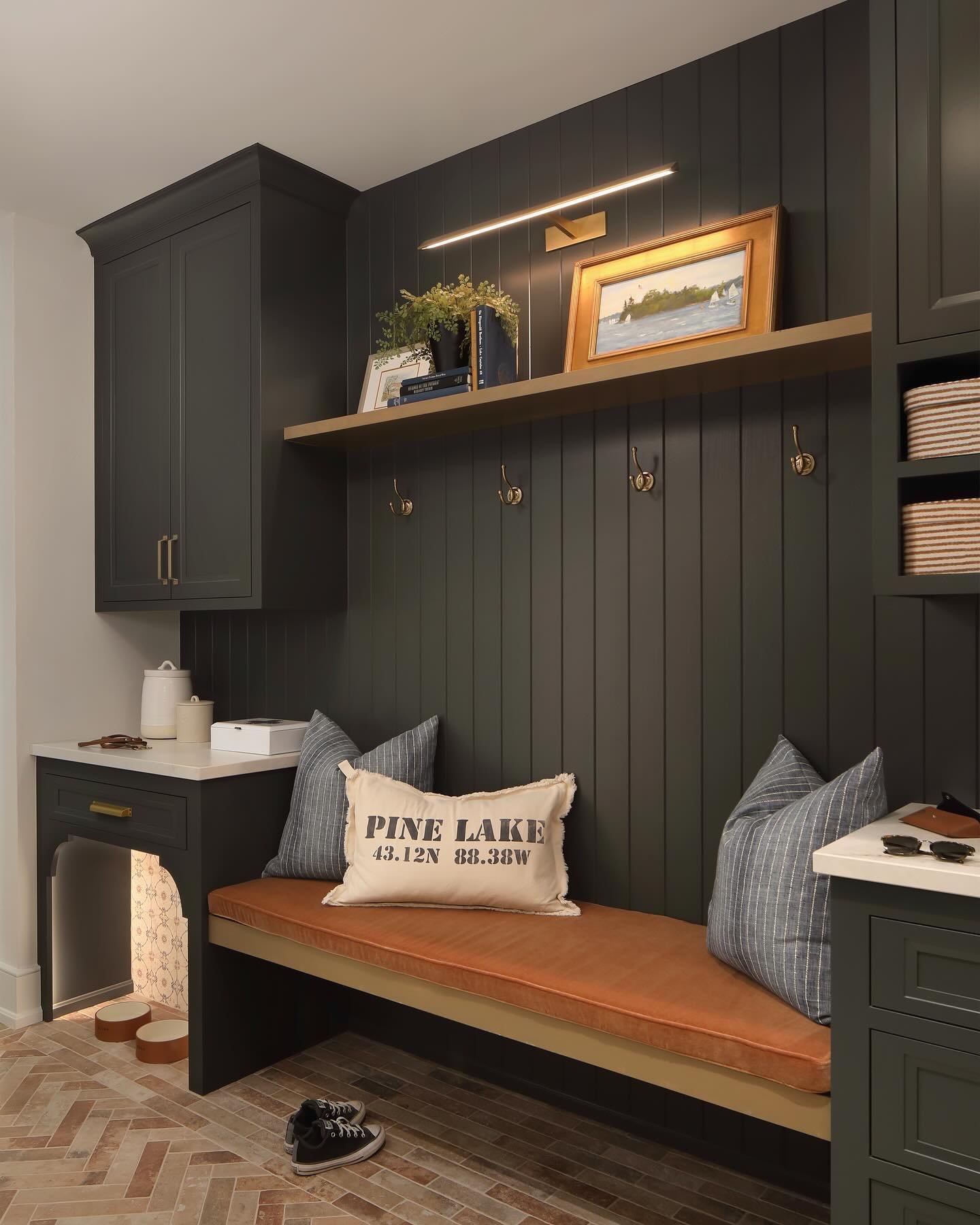 Mudrooms are hard working spaces in the home. This mudroom was designed with some very special features&hellip;
1.) custom blended herringbone tile
2.) a special little nook for pet meal time 🐾
3.) opposite hidden closet of lockers for when you need