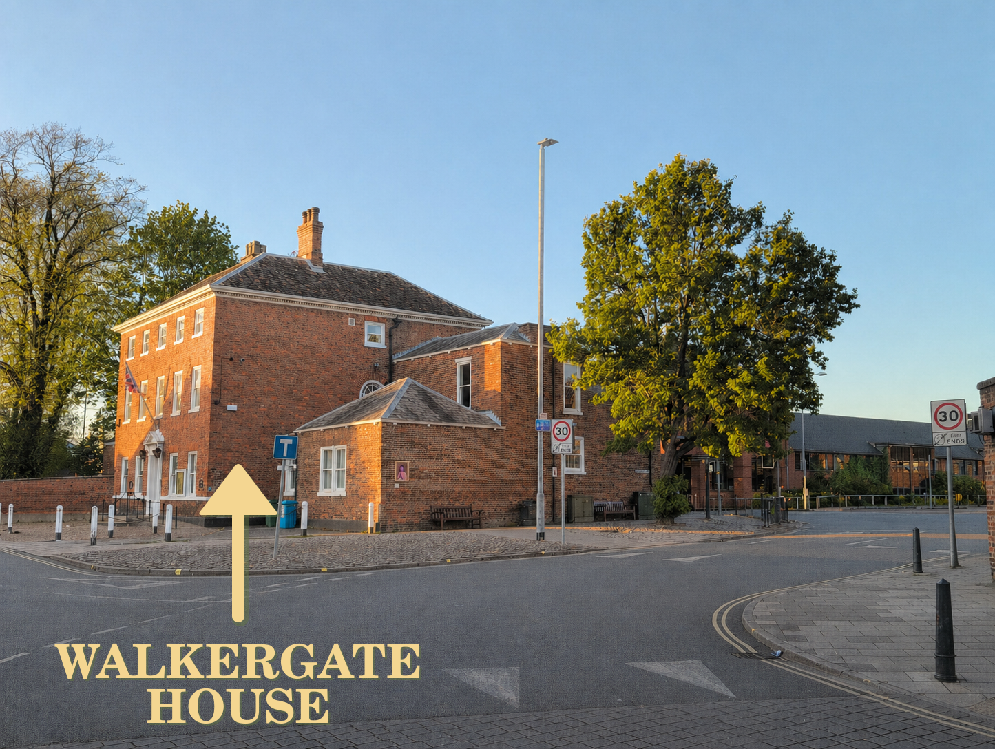 Side view of Walkergate House, showing the red-brick clinic building on the corner of Walkergate in central Beverley.