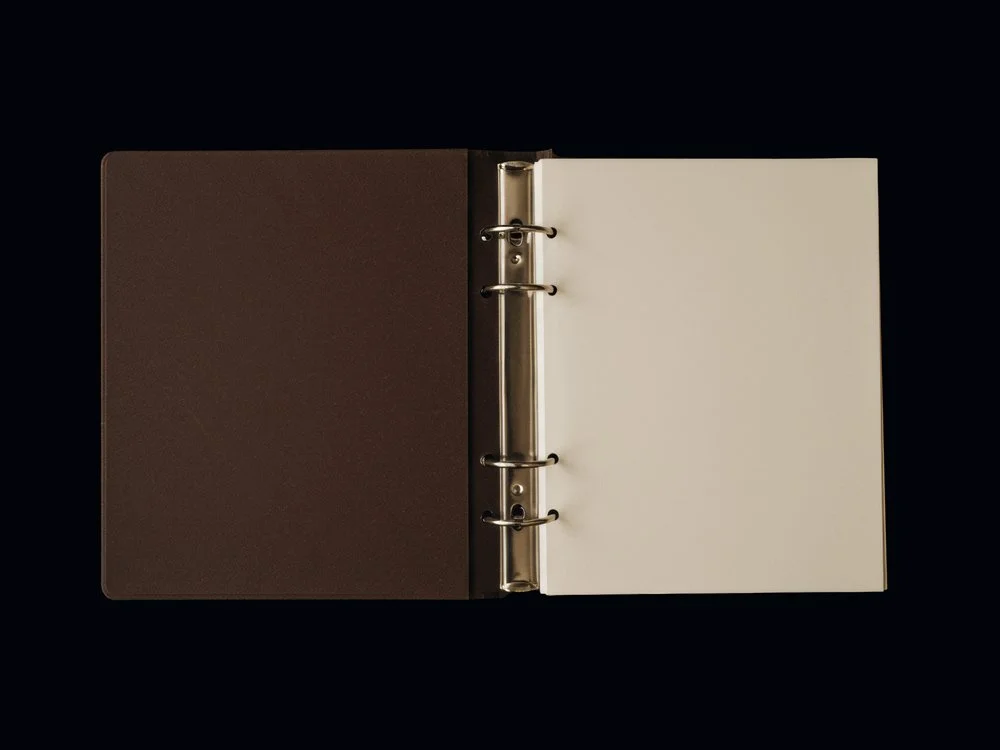 An open folder on a black background.