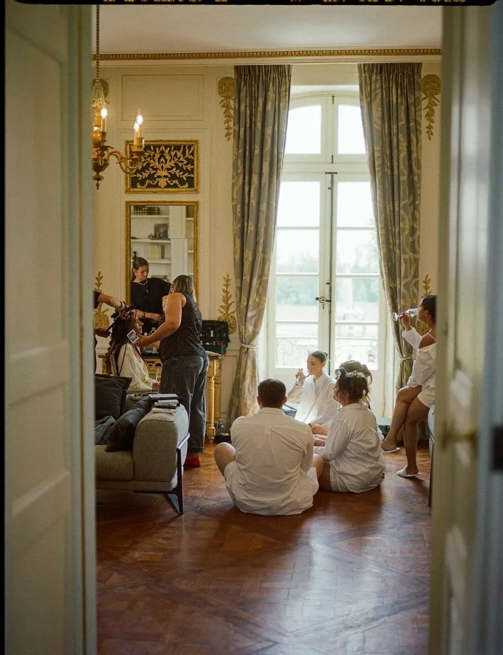 Bridesmaids getting ready in robes.