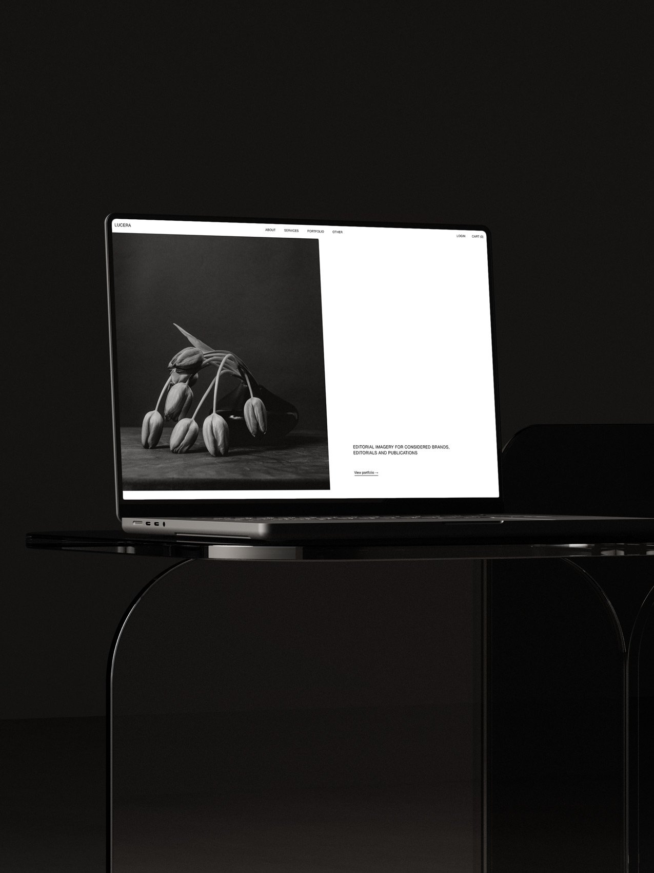 The Lucera Squarespace photography template displayed on a laptop screen.