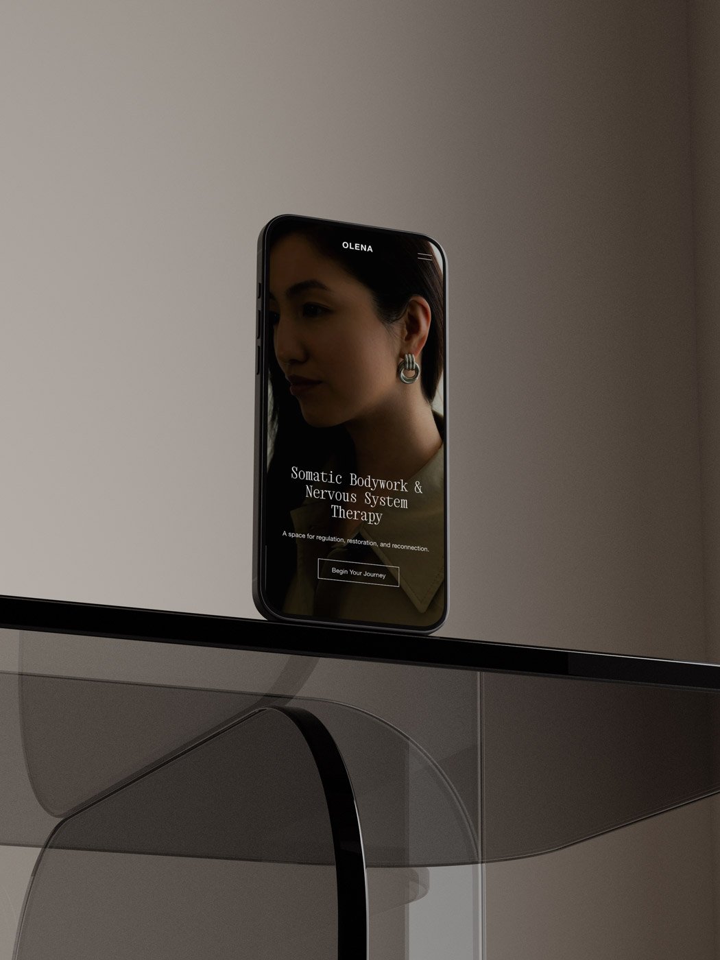 The Olena Squarespace wellness template displayed on a laptop and mobile phone screen.