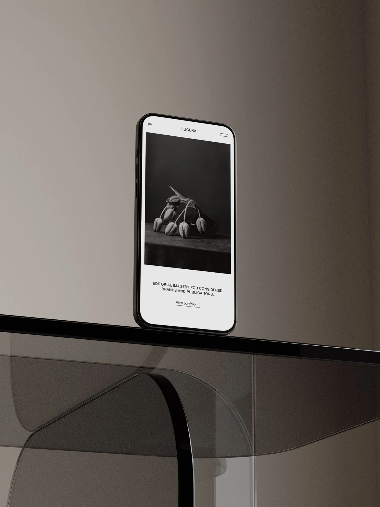 The Lucera Squarespace photography template displayed on a mobile phone screen.