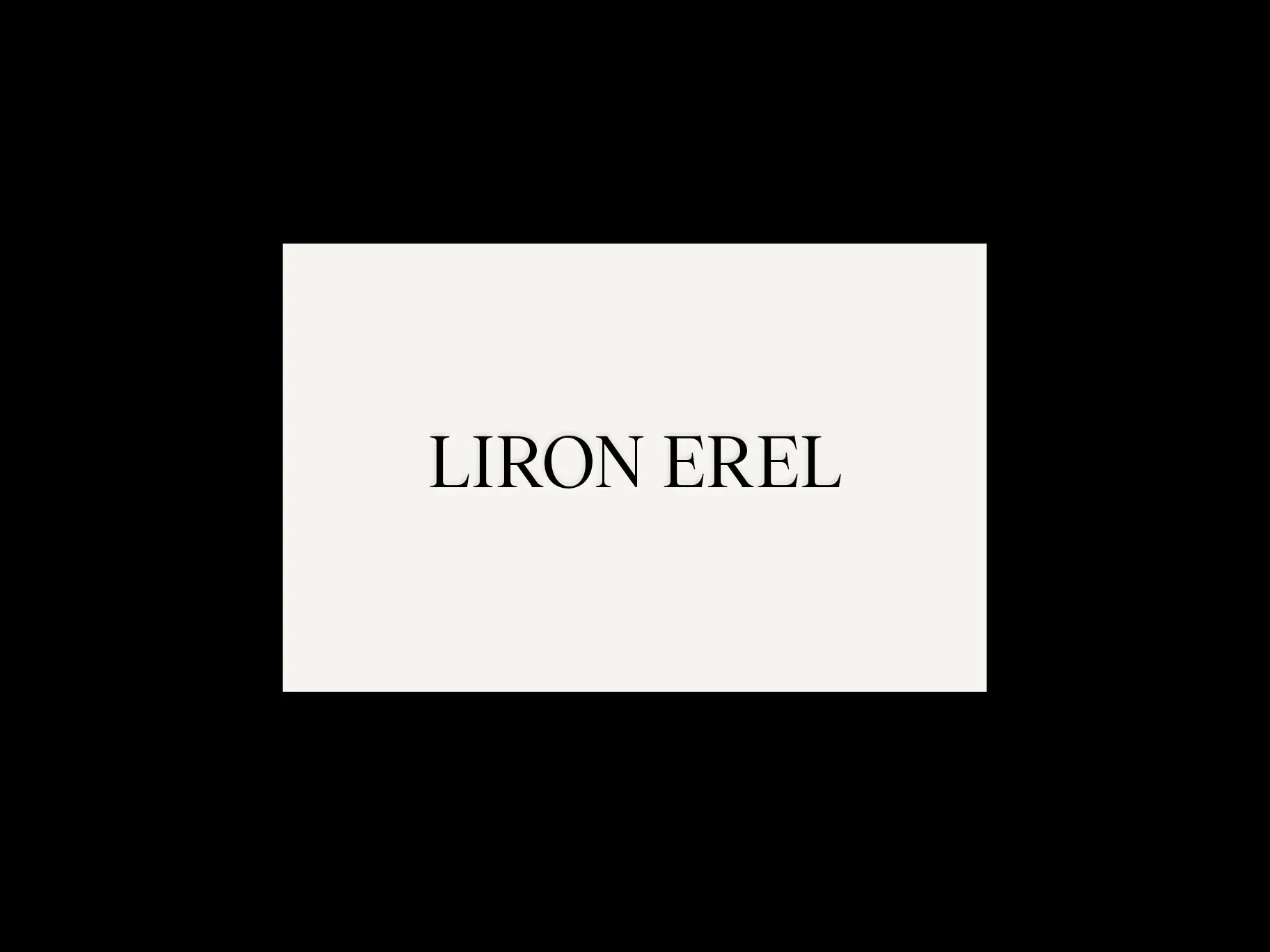 The front of Liron Erel's business card.